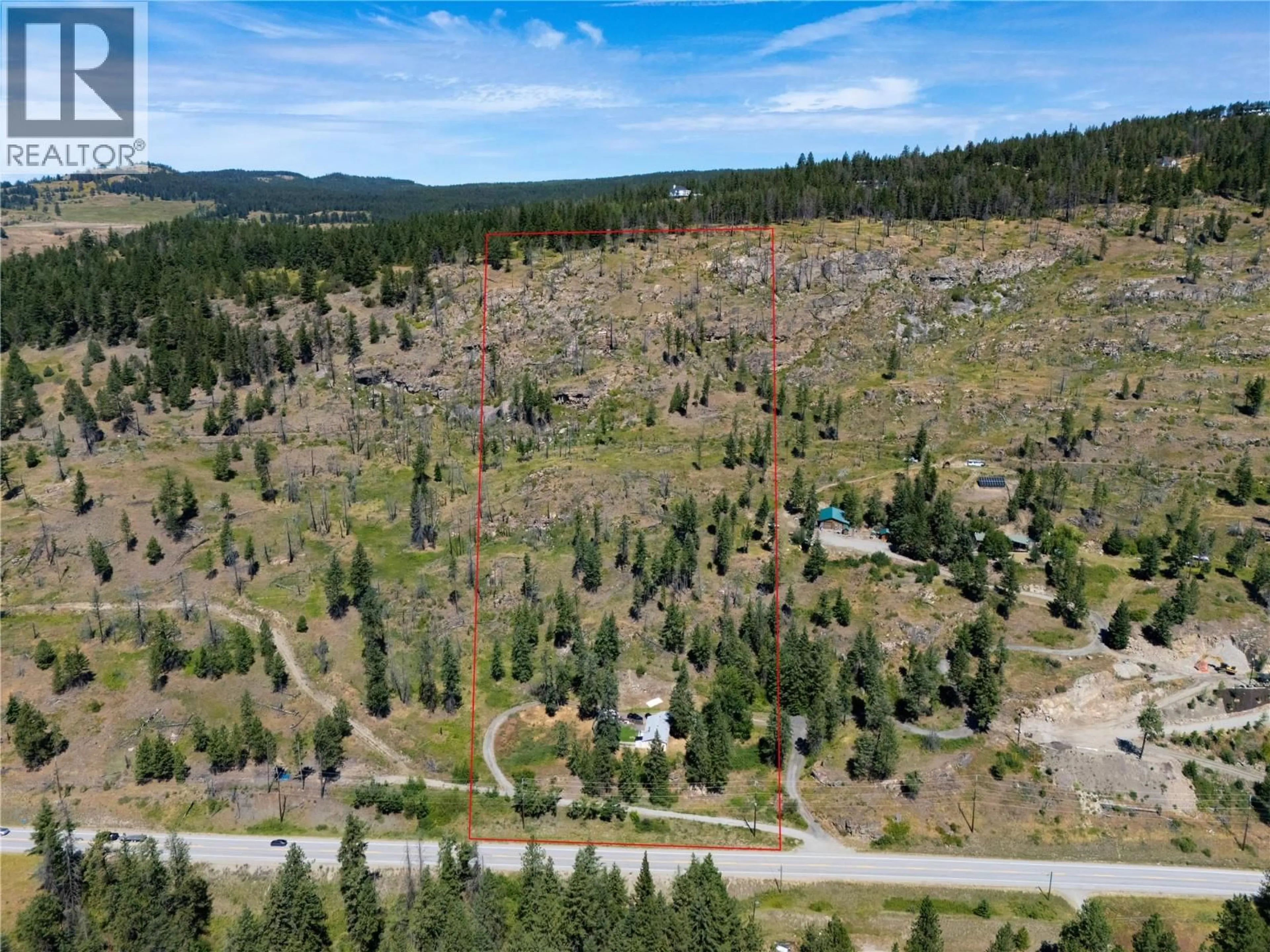 A pic from outside/outdoor area/front of a property/back of a property/a pic from drone, forest/trees view for 6090 HIGHWAY 33 OTHER, Kelowna British Columbia V1P1H8