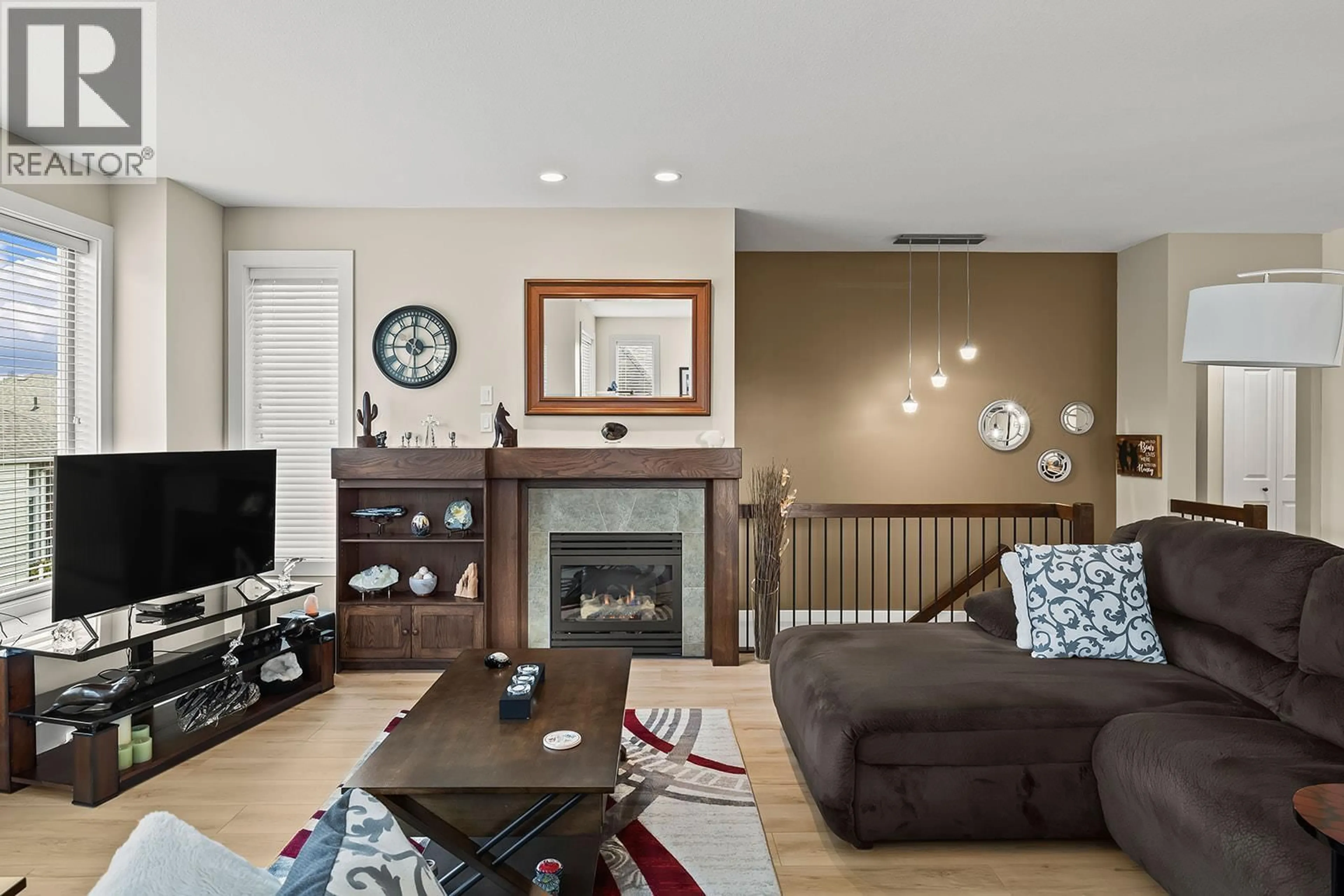 Living room with furniture, wood/laminate floor for 104 - 3155 REIMCHE ROAD, Lake Country British Columbia V4V1V4