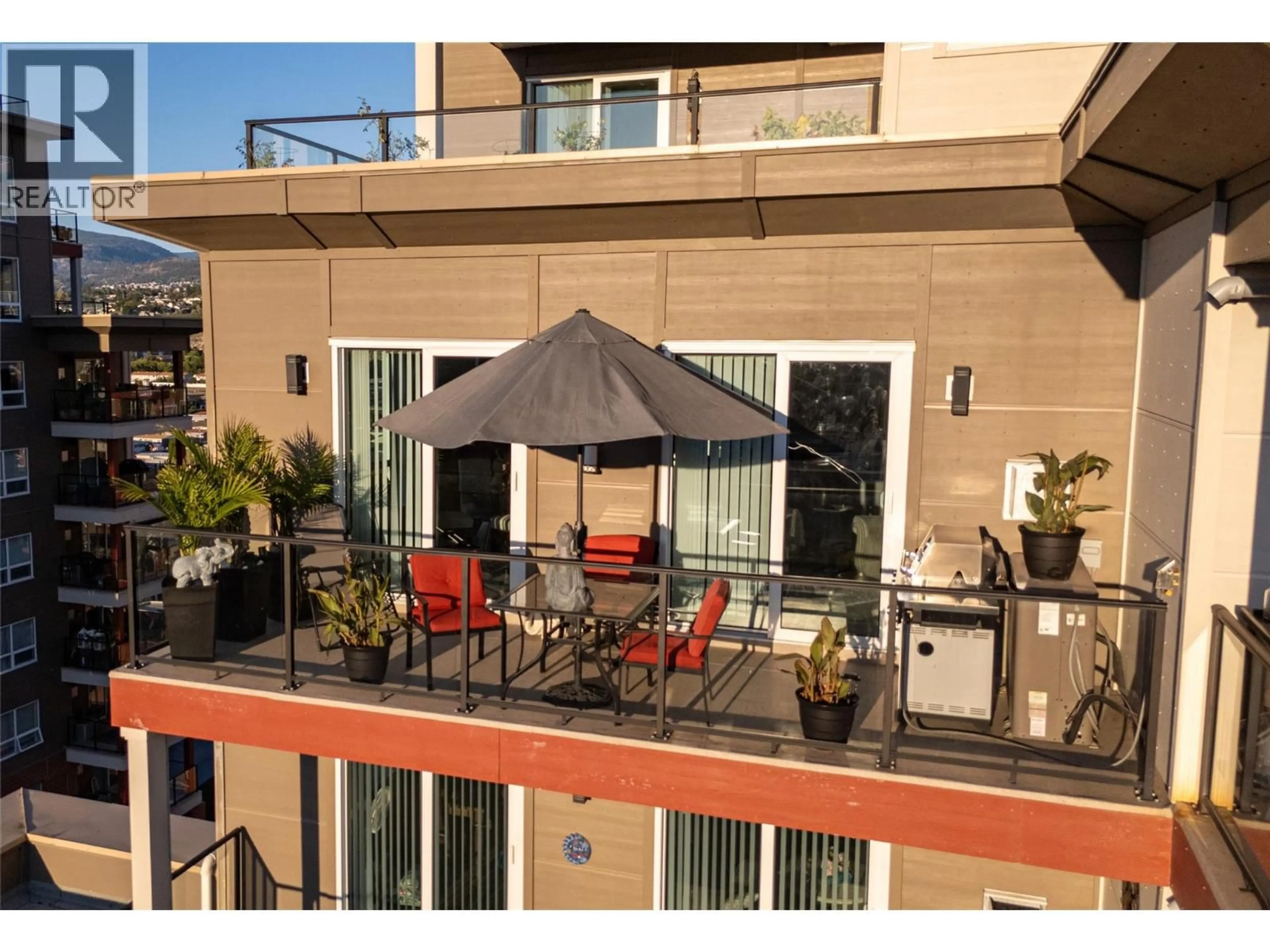 Patio, city buildings view from balcony for 1002 - 3388 SKAHA LAKE ROAD, Penticton British Columbia V2A6G4