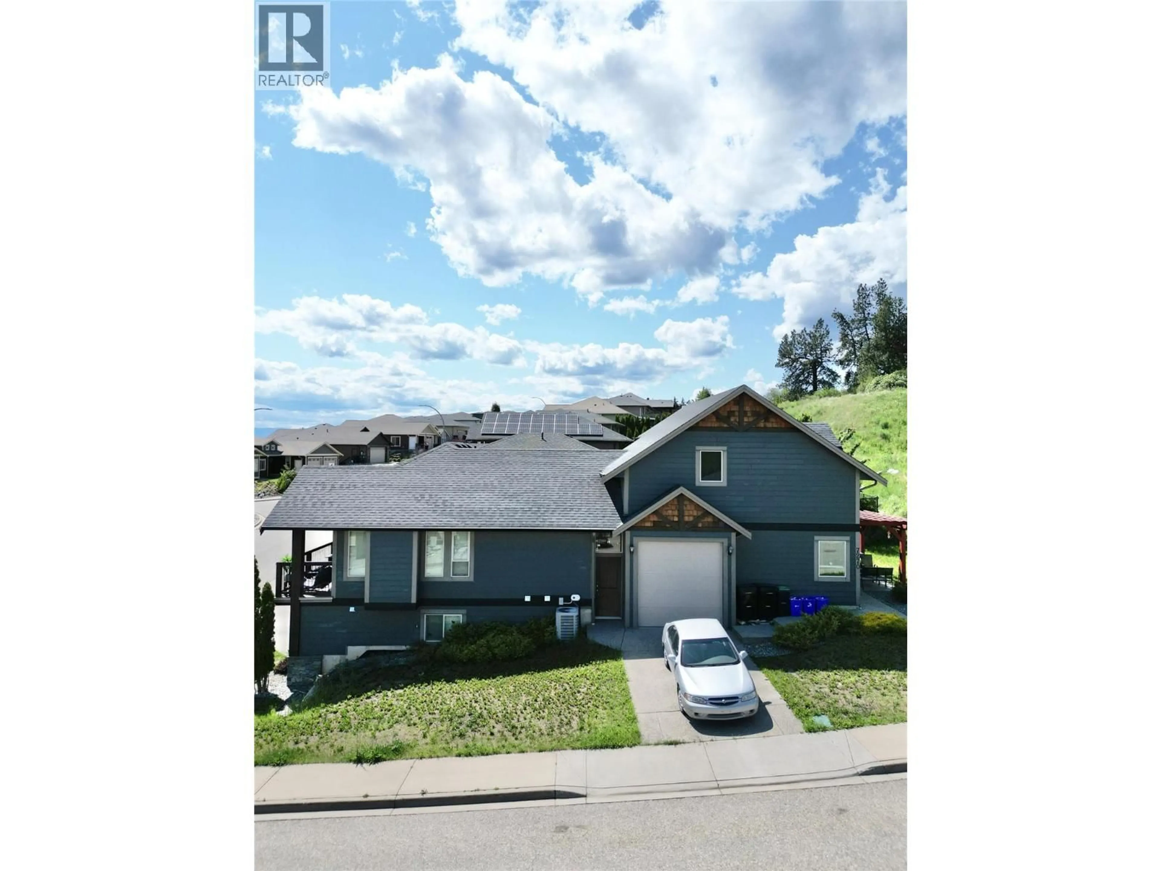 A pic from outside/outdoor area/front of a property/back of a property/a pic from drone, street for 7400 SUN PEAKS DRIVE, Vernon British Columbia V1B4C7