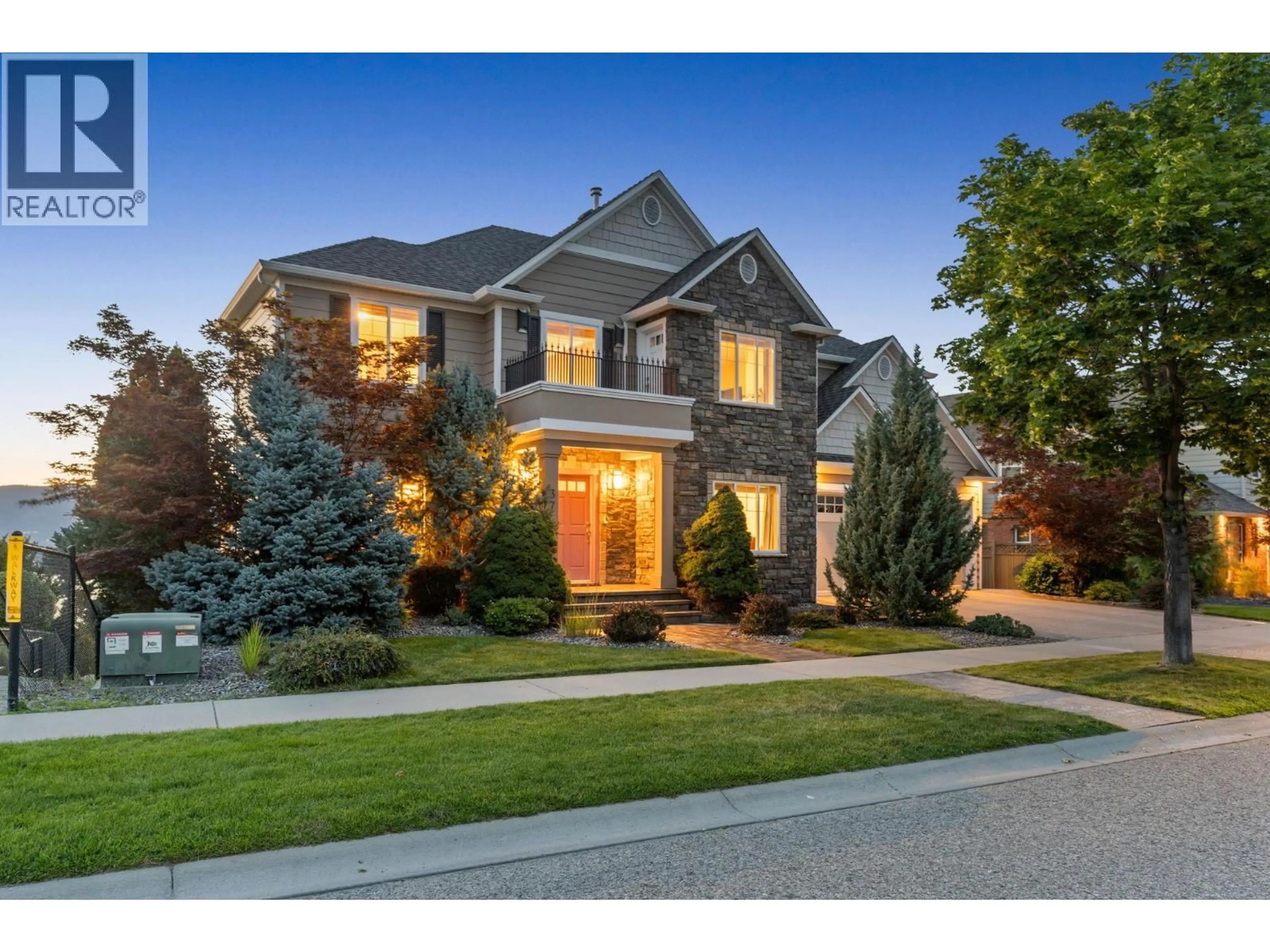 Home with brick exterior material, street for 374 QUILCHENA DRIVE, Kelowna British Columbia V1W4W4