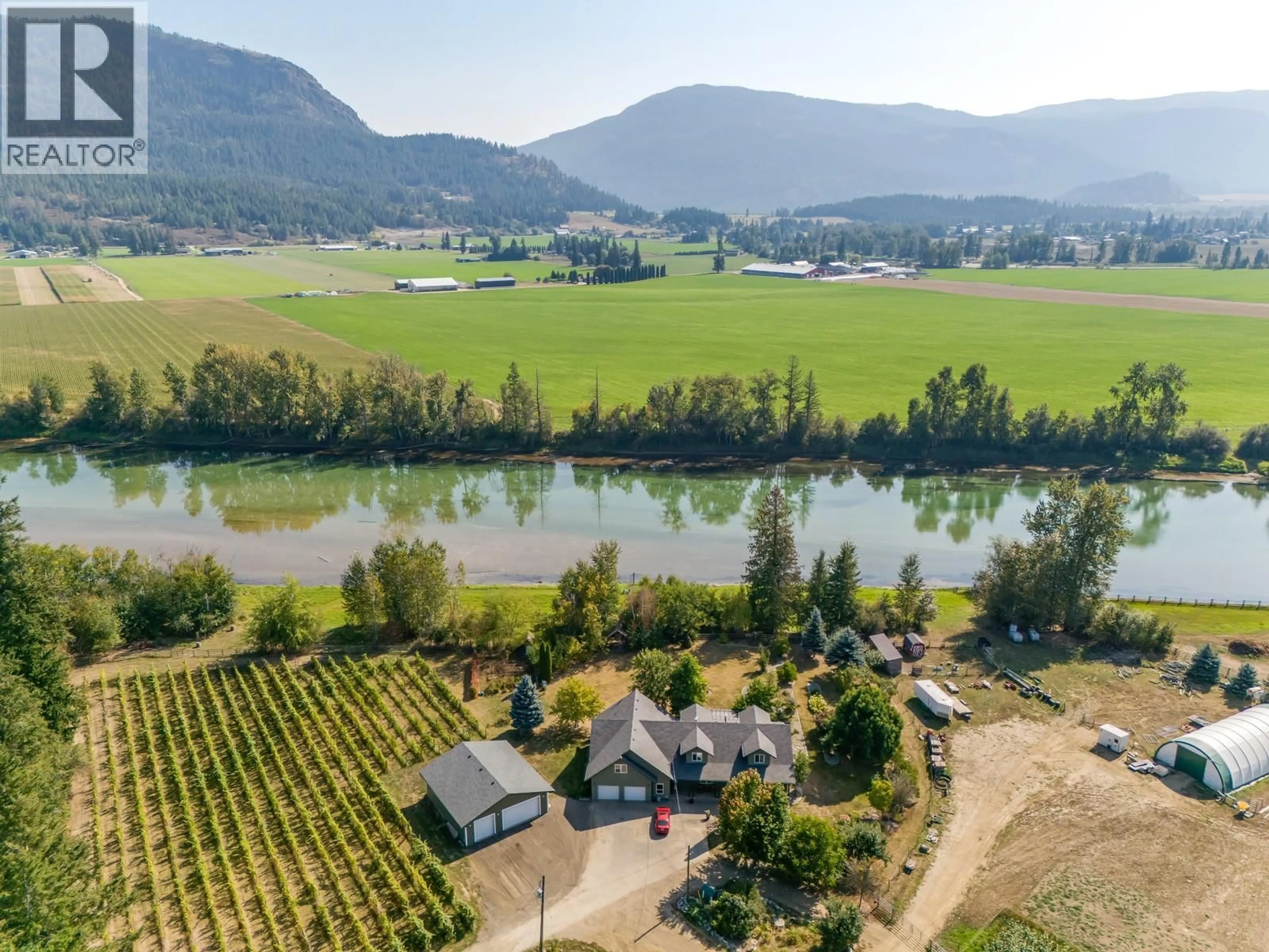 A pic from outside/outdoor area/front of a property/back of a property/a pic from drone, water/lake/river/ocean view for 70 WATERSIDE ROAD, Enderby British Columbia V0E1V3
