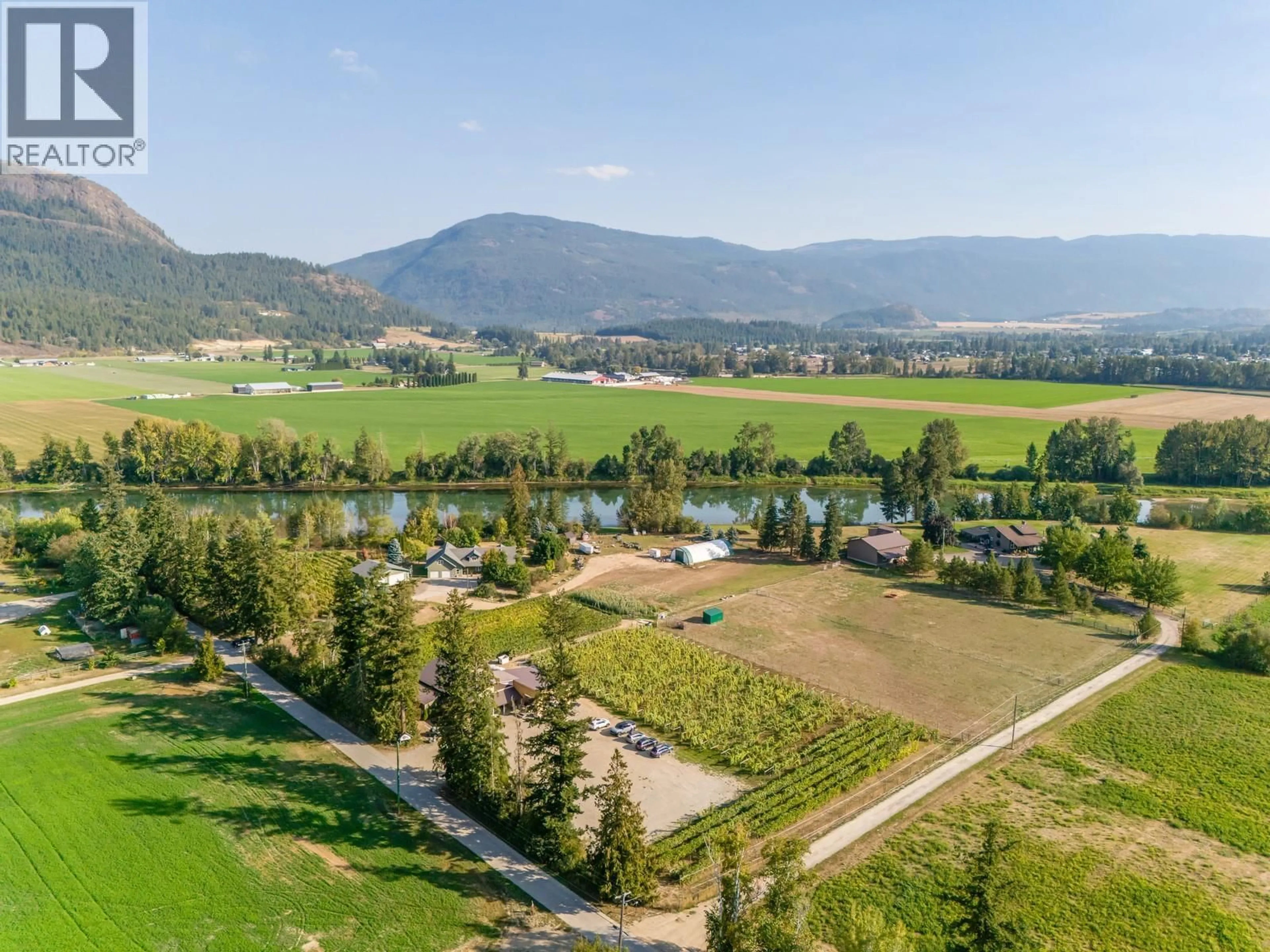 A pic from outside/outdoor area/front of a property/back of a property/a pic from drone, water/lake/river/ocean view for 70 WATERSIDE ROAD, Enderby British Columbia V0E1V3