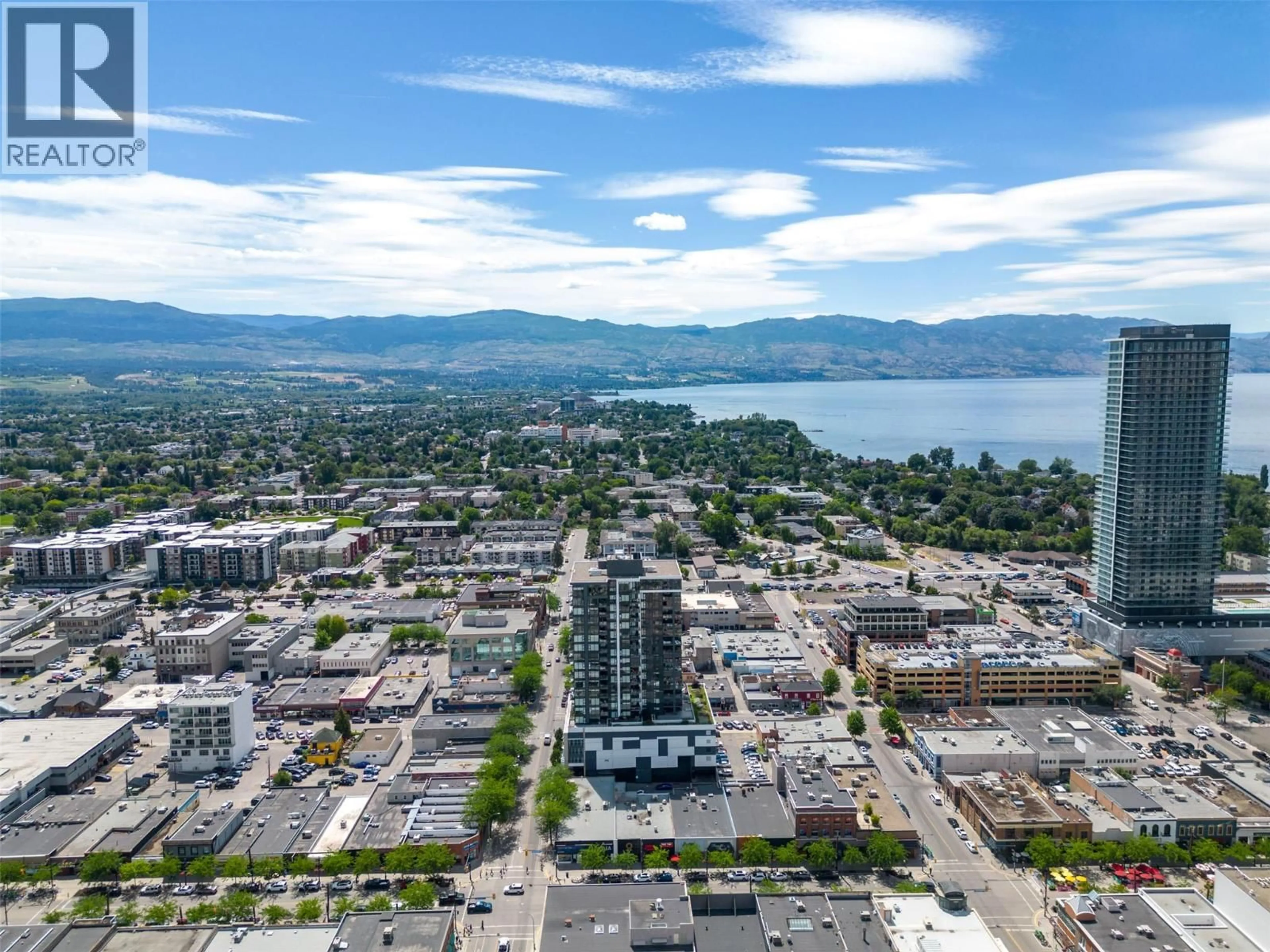 A pic from outside/outdoor area/front of a property/back of a property/a pic from drone, mountain view for 703 - 1588 ELLIS STREET, Kelowna British Columbia V1Y0H1