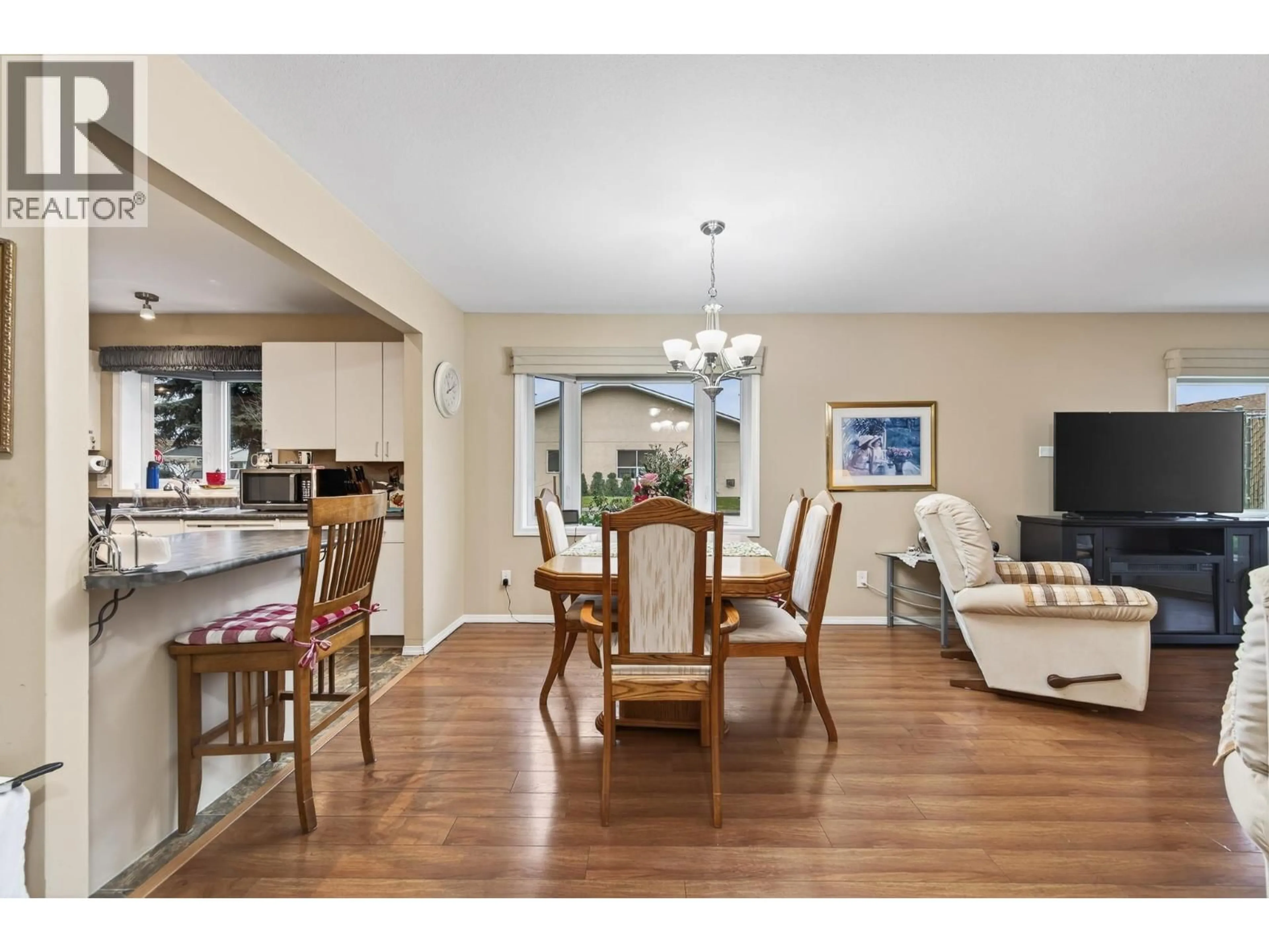 Open concept kitchen, wood/laminate floor for 1297 14TH STREET, Kamloops British Columbia V2B8K8