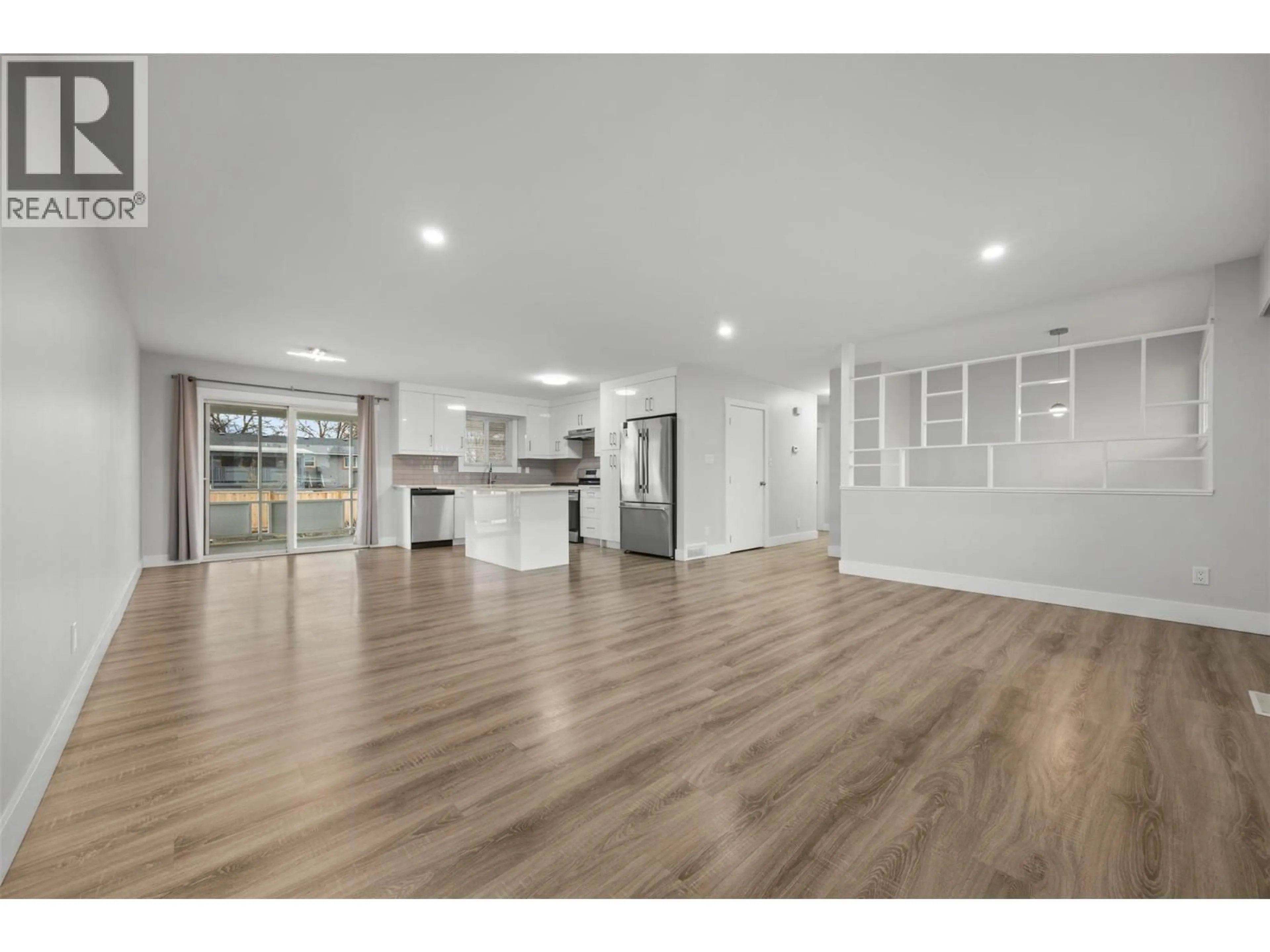 Open concept kitchen, wood/laminate floor for 245 ADVENTURE ROAD, Kelowna British Columbia V1X1N5