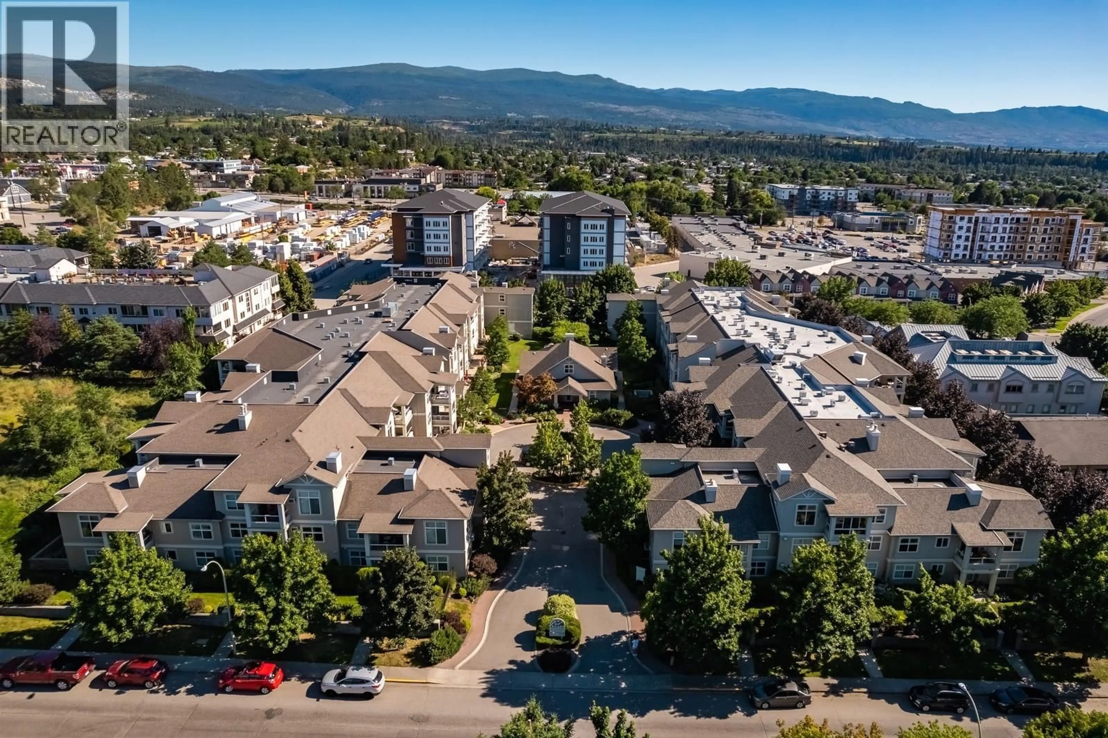 A pic from outside/outdoor area/front of a property/back of a property/a pic from drone, mountain view for 206 - 555 HOUGHTON ROAD, Kelowna British Columbia V1X7P9