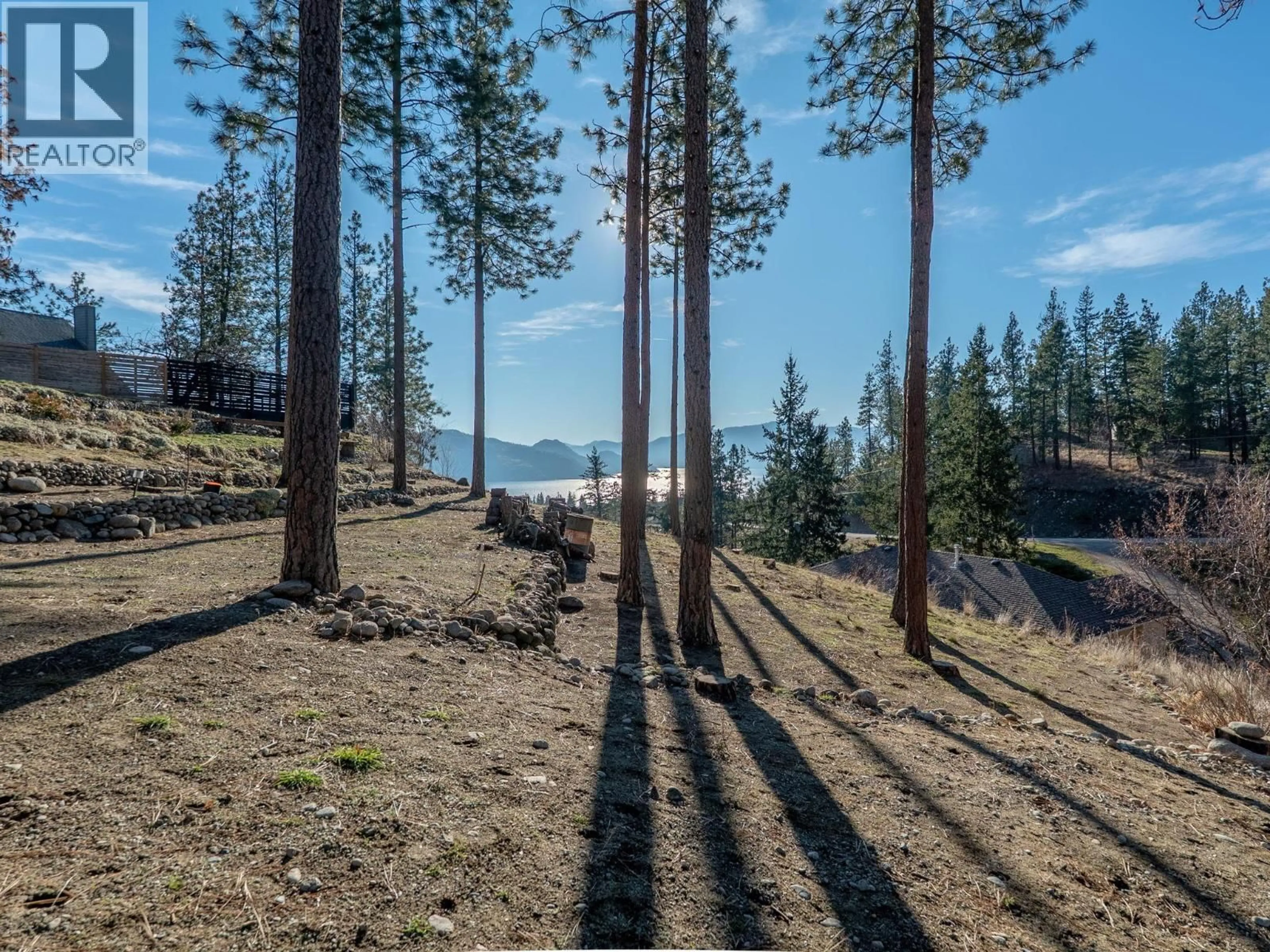 A pic from outside/outdoor area/front of a property/back of a property/a pic from drone, forest/trees view for 3947 TREPANIER HEIGHTS PLACE, Peachland British Columbia V0H1X2