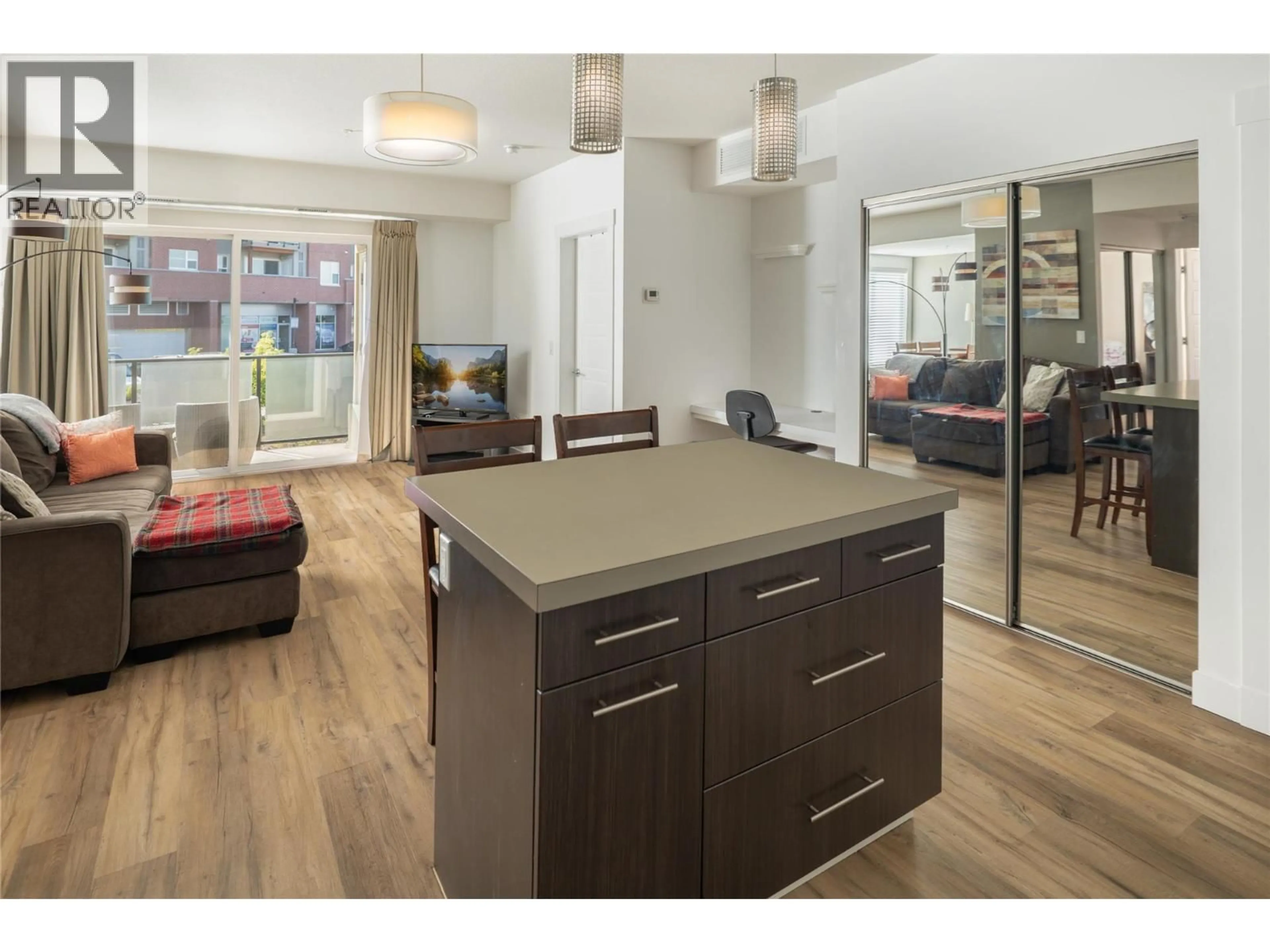 Open concept kitchen, wood/laminate floor for 208 - 985 ACADEMY WAY, Kelowna British Columbia V1V3C8