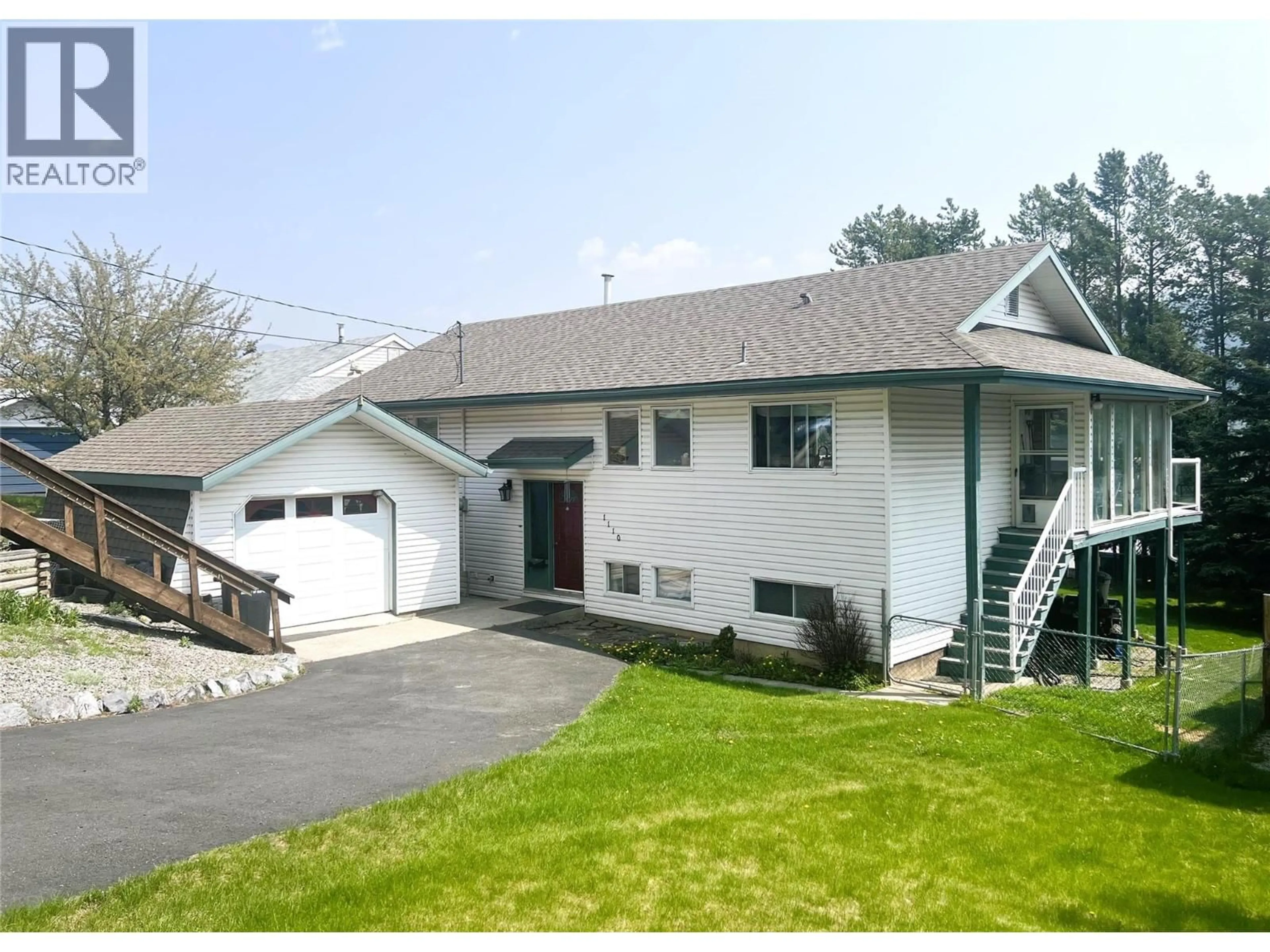 Home with vinyl exterior material, street for 1110 ASH CRESCENT, Elkford British Columbia V0B1H0