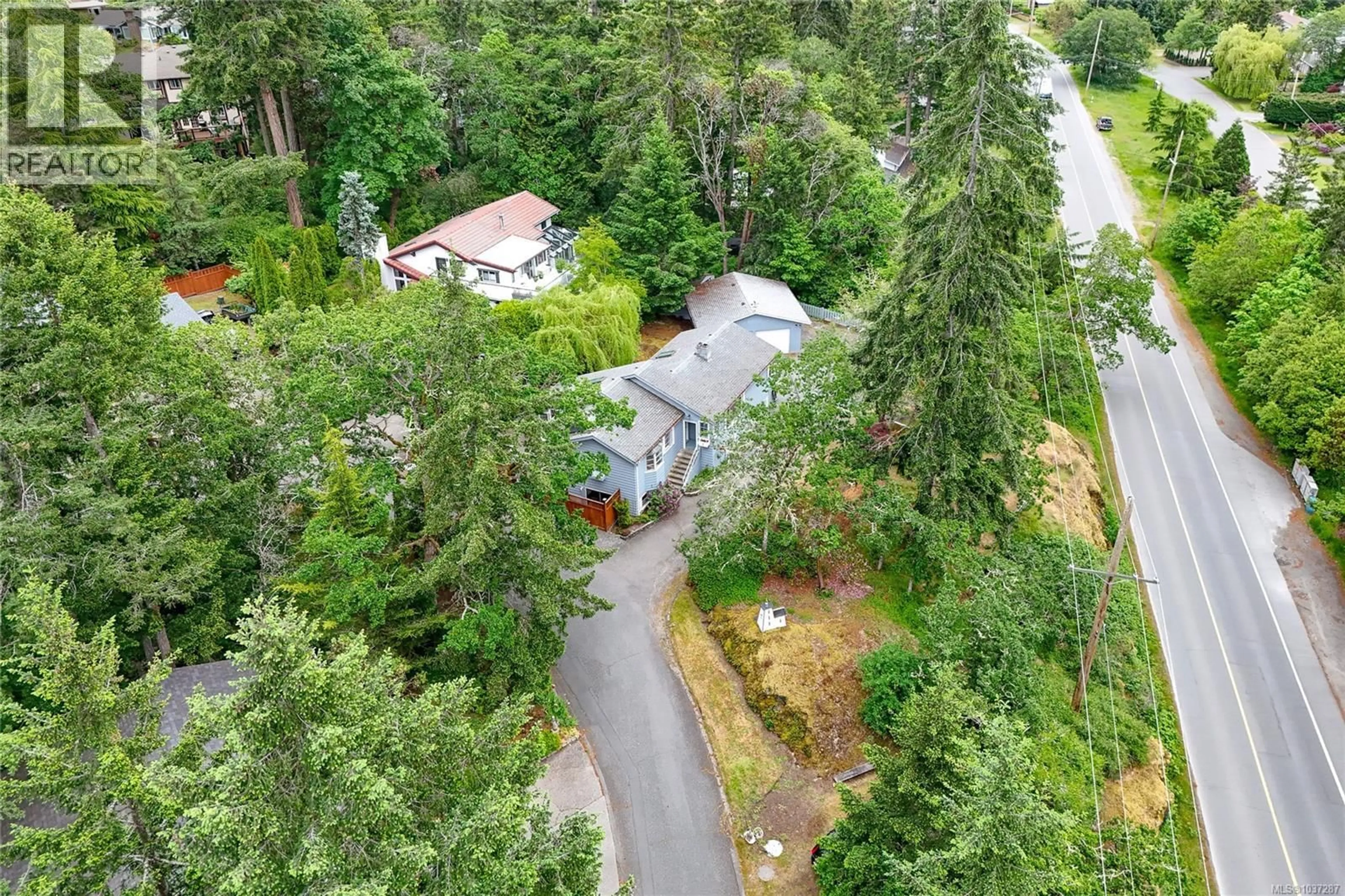 A pic from outside/outdoor area/front of a property/back of a property/a pic from drone, forest/trees view for 2 - 6755 WALLACE DRIVE, Central Saanich British Columbia V8M1A2