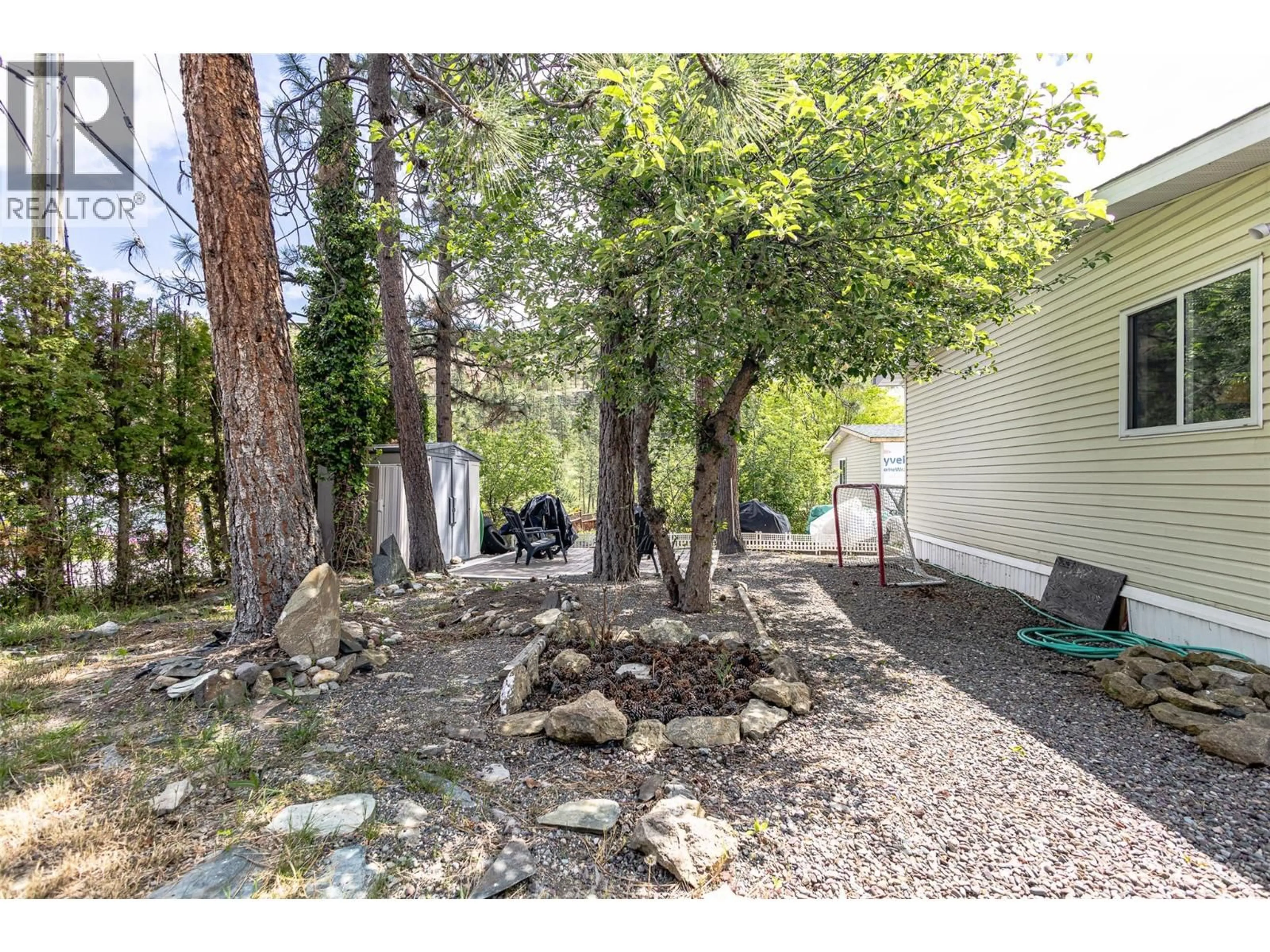 A pic from outside/outdoor area/front of a property/back of a property/a pic from drone, forest/trees view for 30 - 3585 ELK ROAD, West Kelowna British Columbia V4T1R5