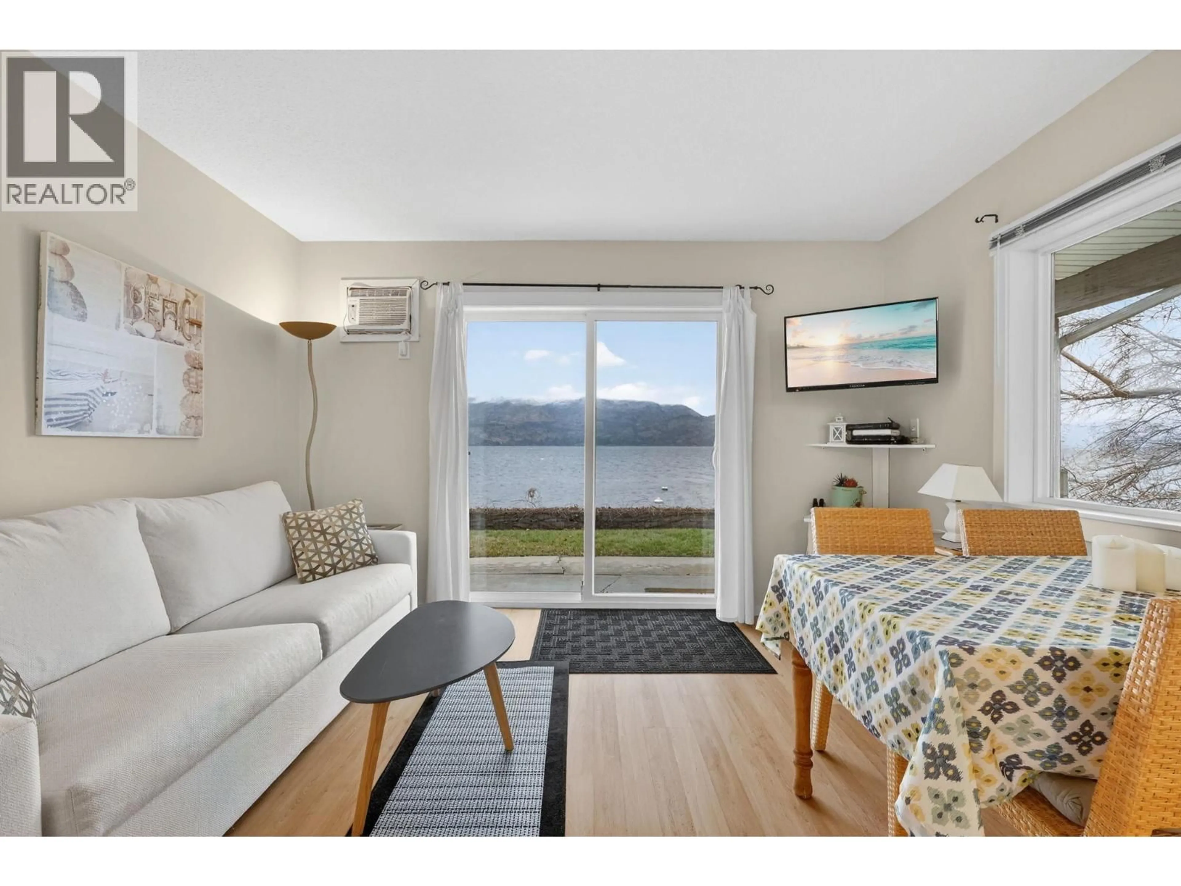Living room with furniture, wood/laminate floor for 105 - 3050 SECLUSION BAY ROAD, Westbank British Columbia V0H2A0