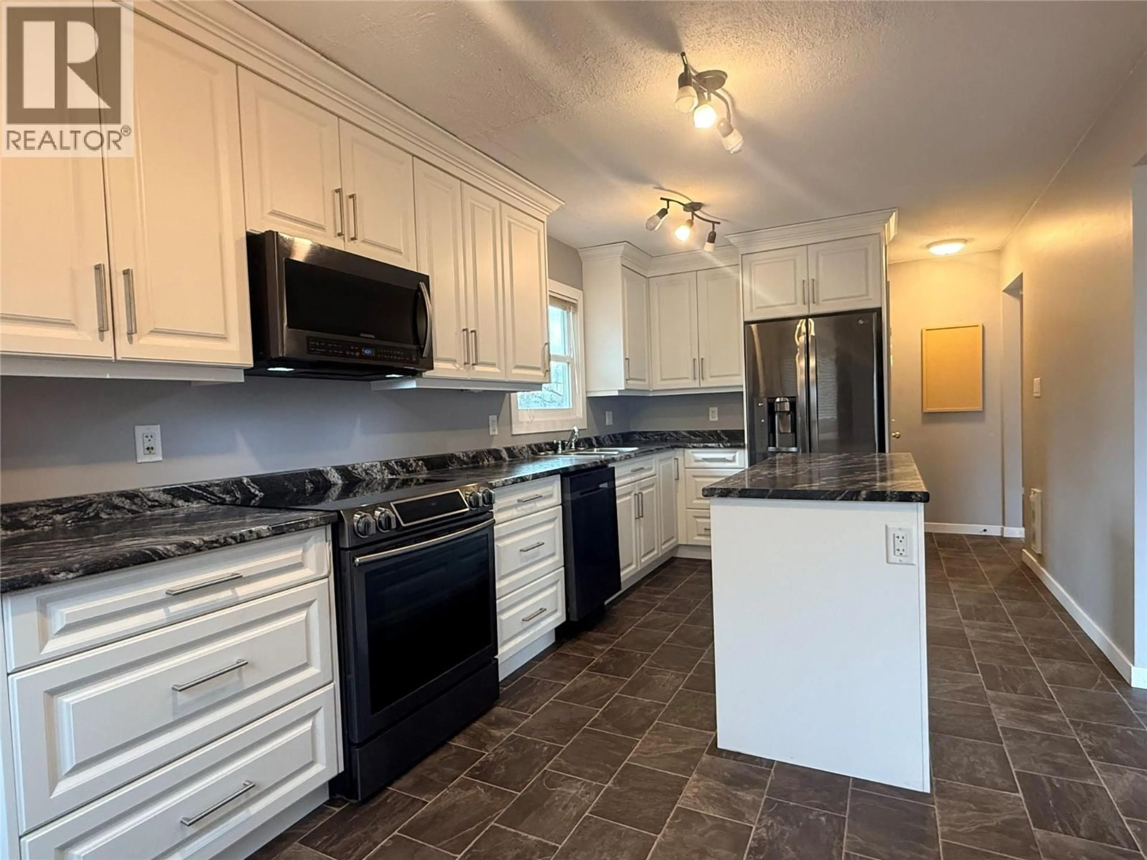 Open concept kitchen, ceramic/tile floor for 3503 35 STREET, Vernon British Columbia V1T6C2