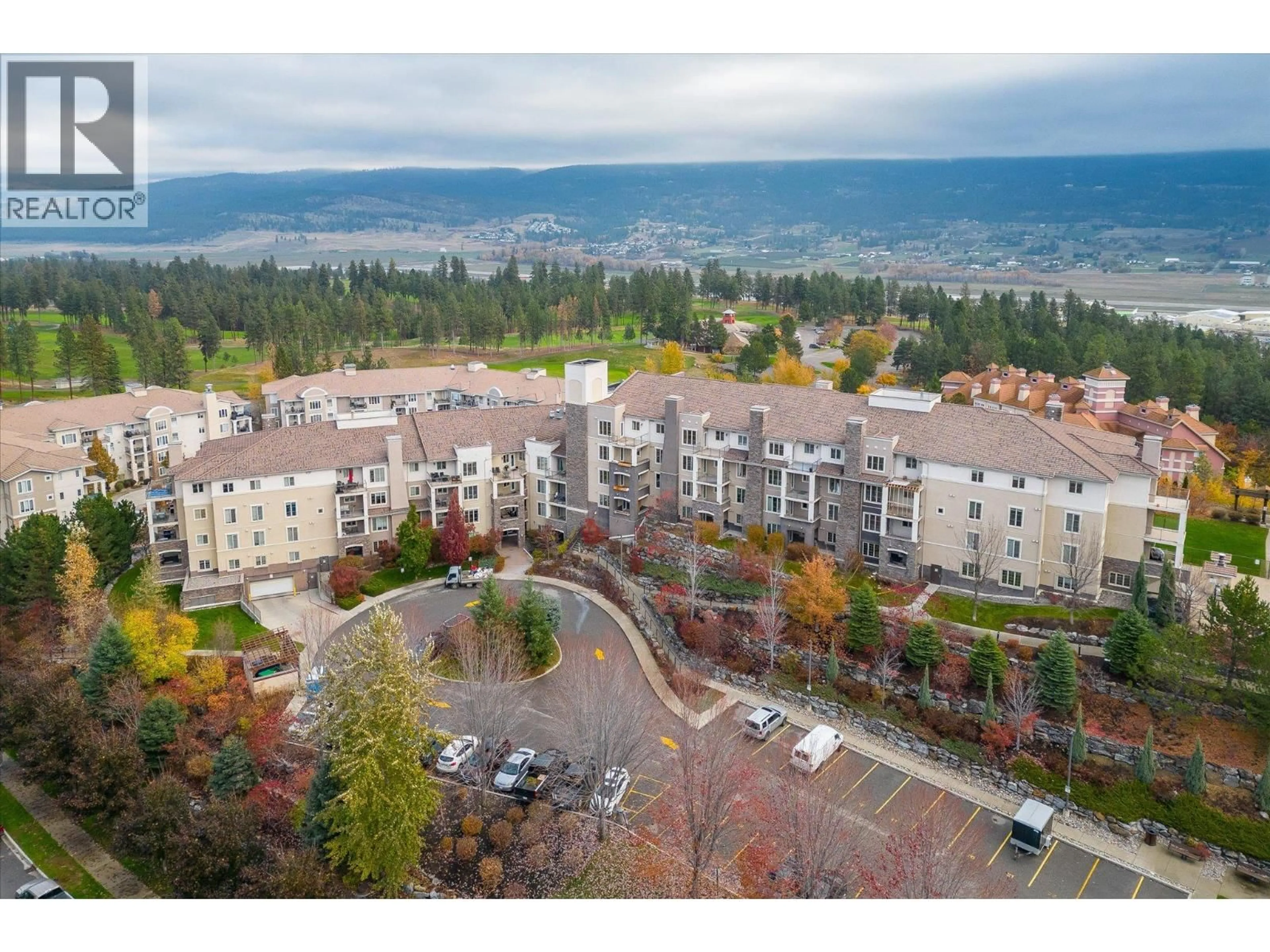 A pic from outside/outdoor area/front of a property/back of a property/a pic from drone, mountain view for 1317 - 1875 COUNTRY CLUB DRIVE, Kelowna British Columbia V1V2W7