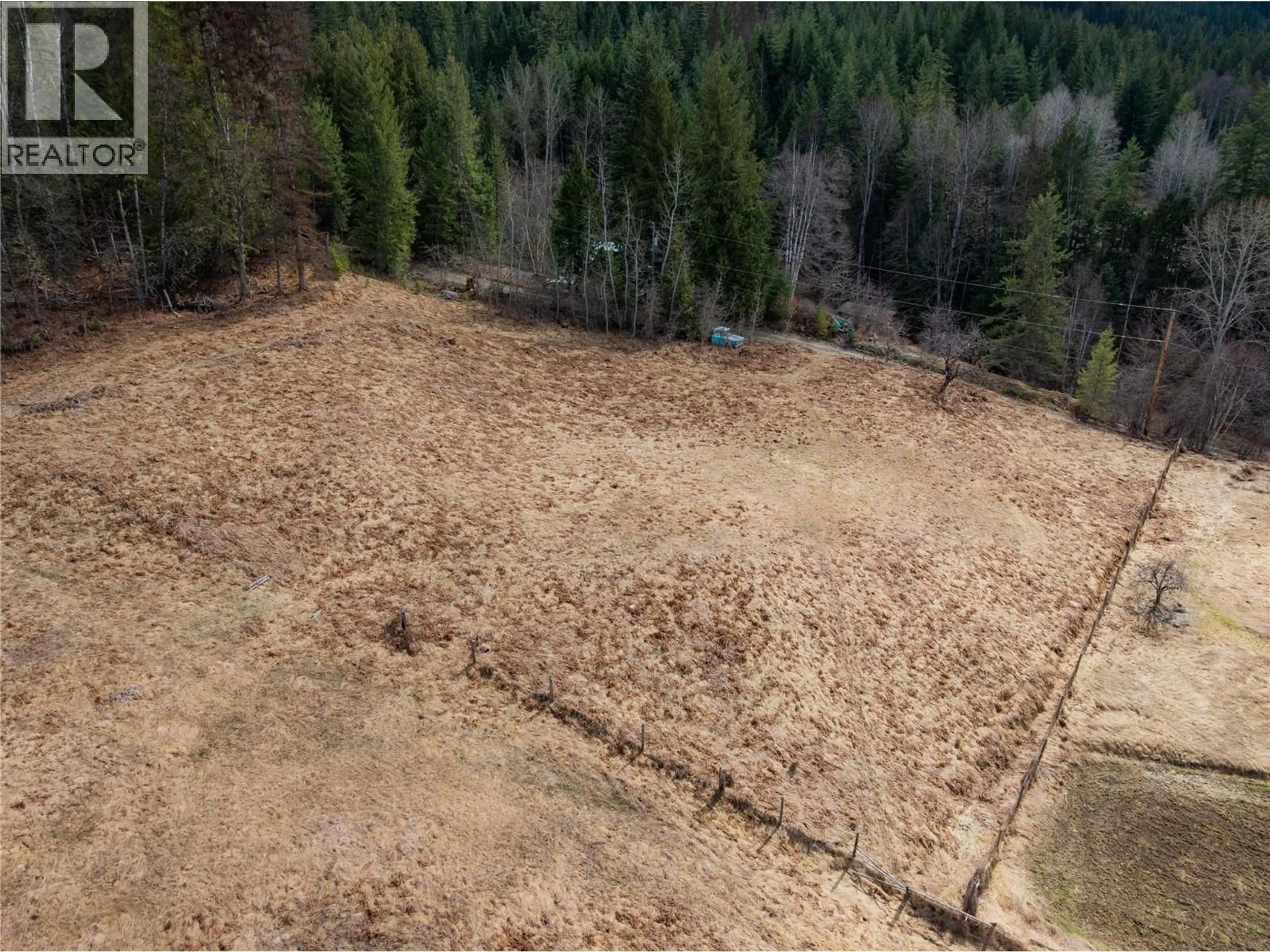 A pic from outside/outdoor area/front of a property/back of a property/a pic from drone, forest/trees view for 6943 KANIGAN ROAD, Appledale British Columbia V0G2J0
