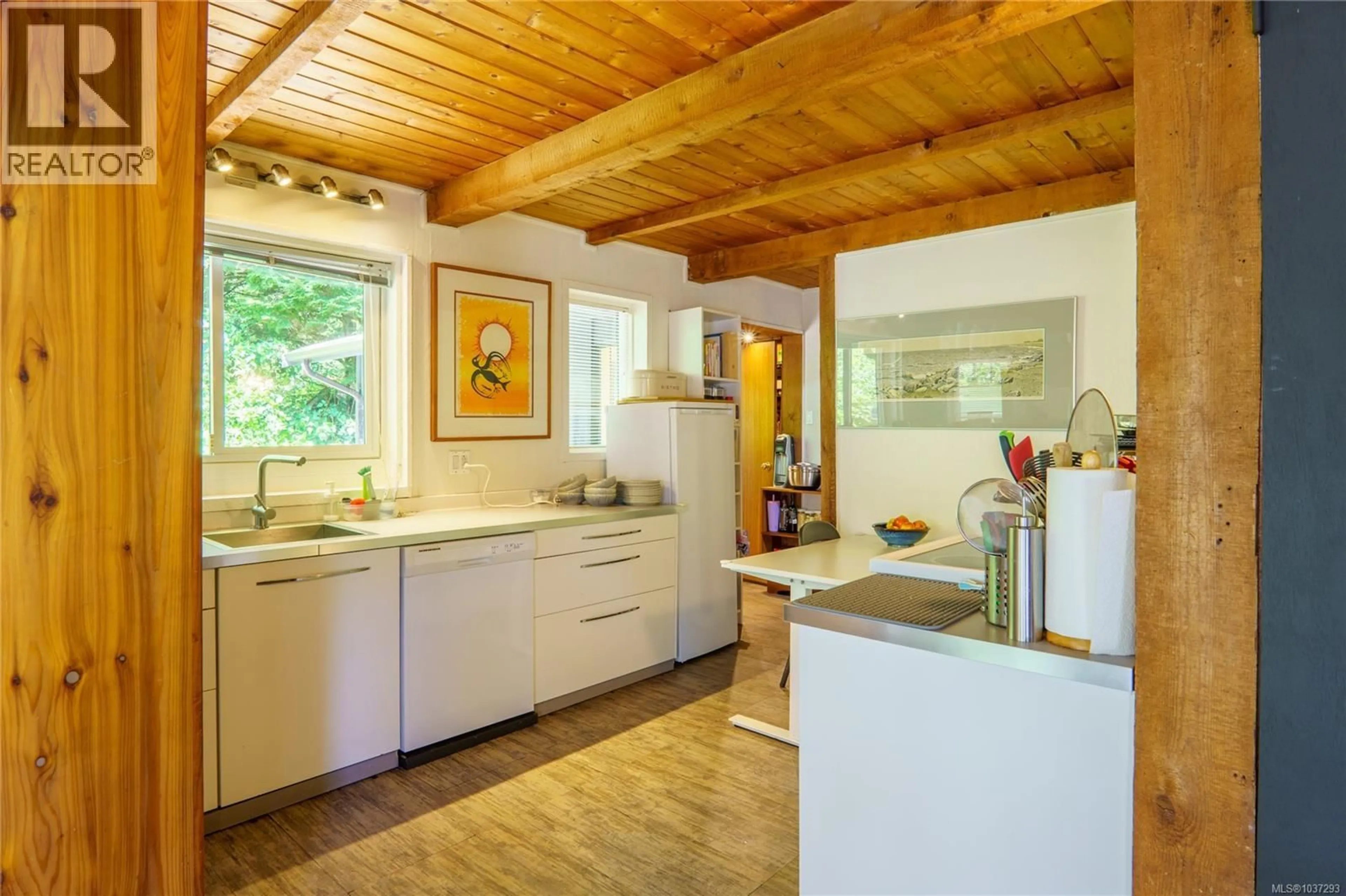 Open concept kitchen, wood/laminate floor for 1334 CHESTERMAN BEACH ROAD, Tofino British Columbia V0R2Z0