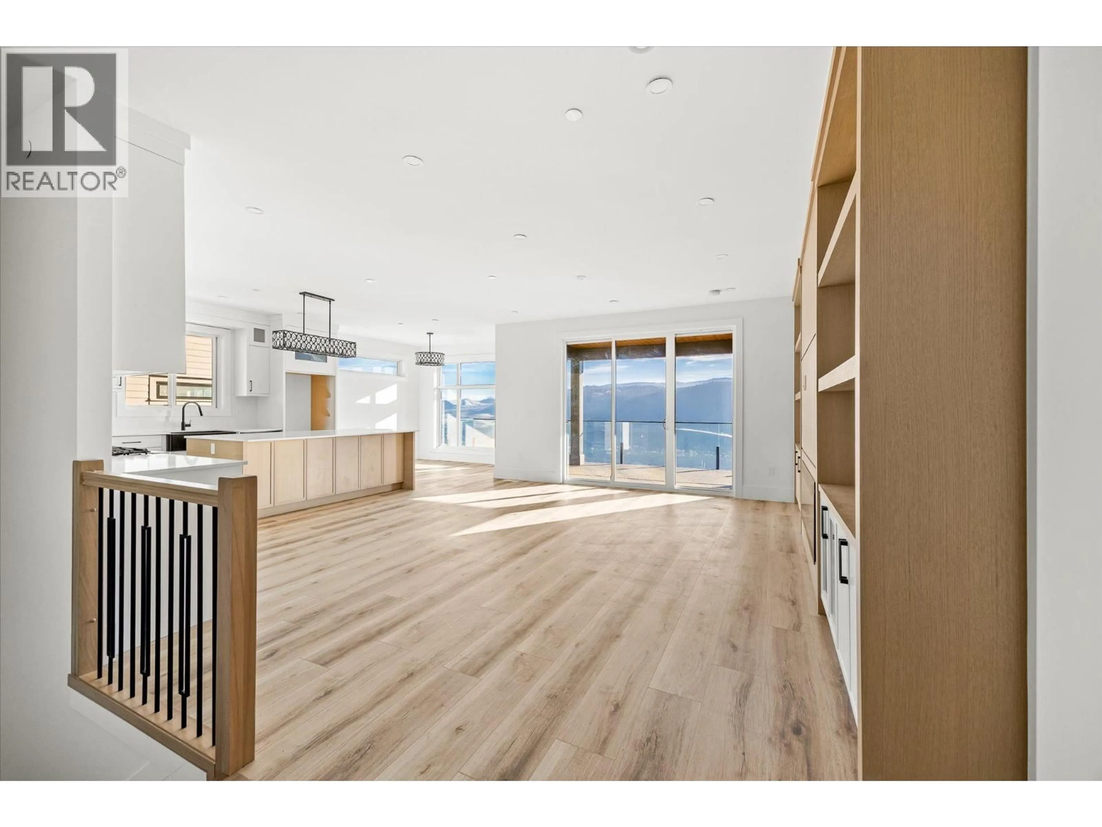 Open concept kitchen, wood/laminate floor for 8944 TAVISTOCK ROAD, Vernon British Columbia V1H2K9