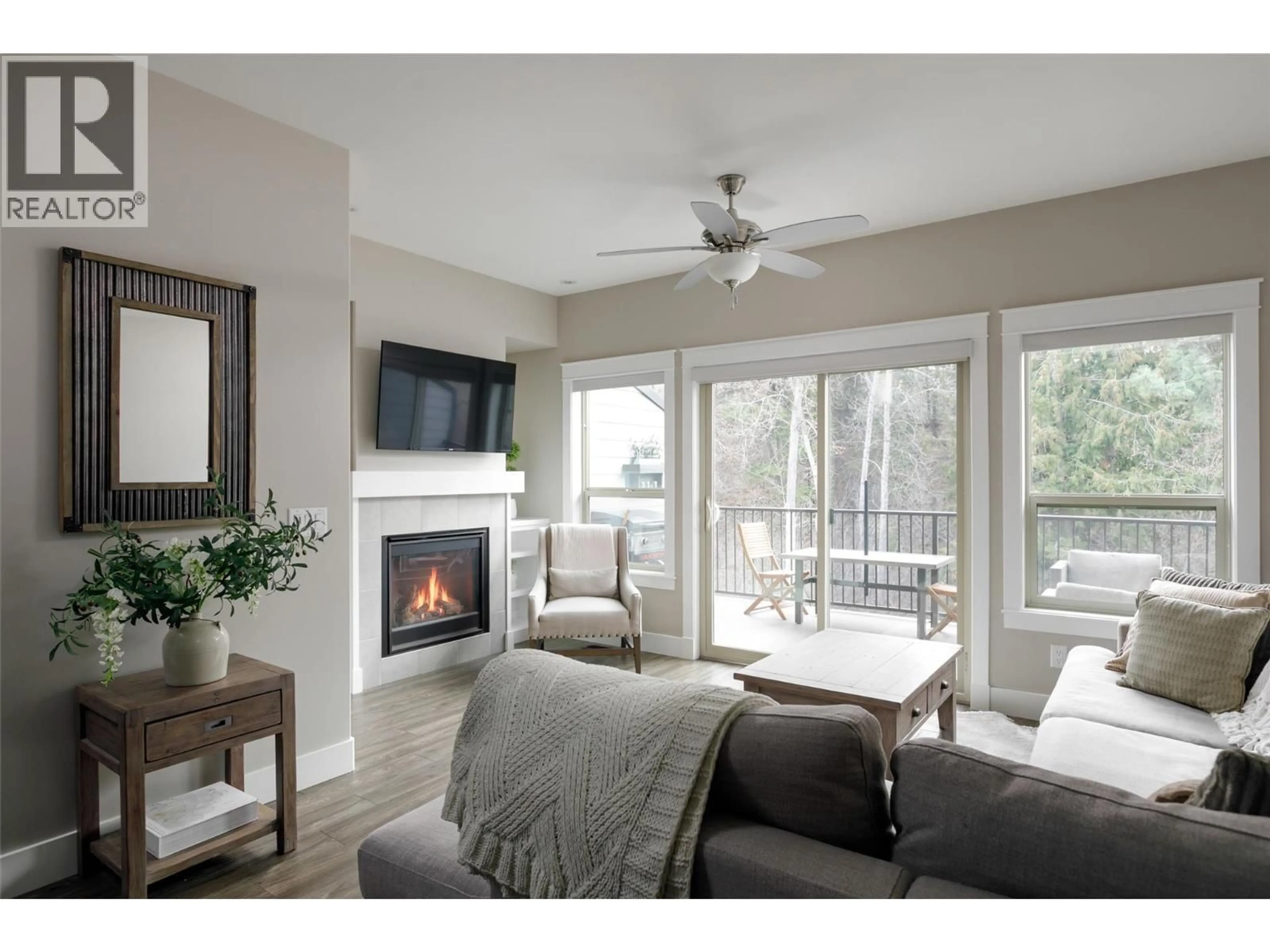 Living room with furniture, wood/laminate floor for 49 - 3359 COUGAR ROAD, Westbank British Columbia V4T3G1