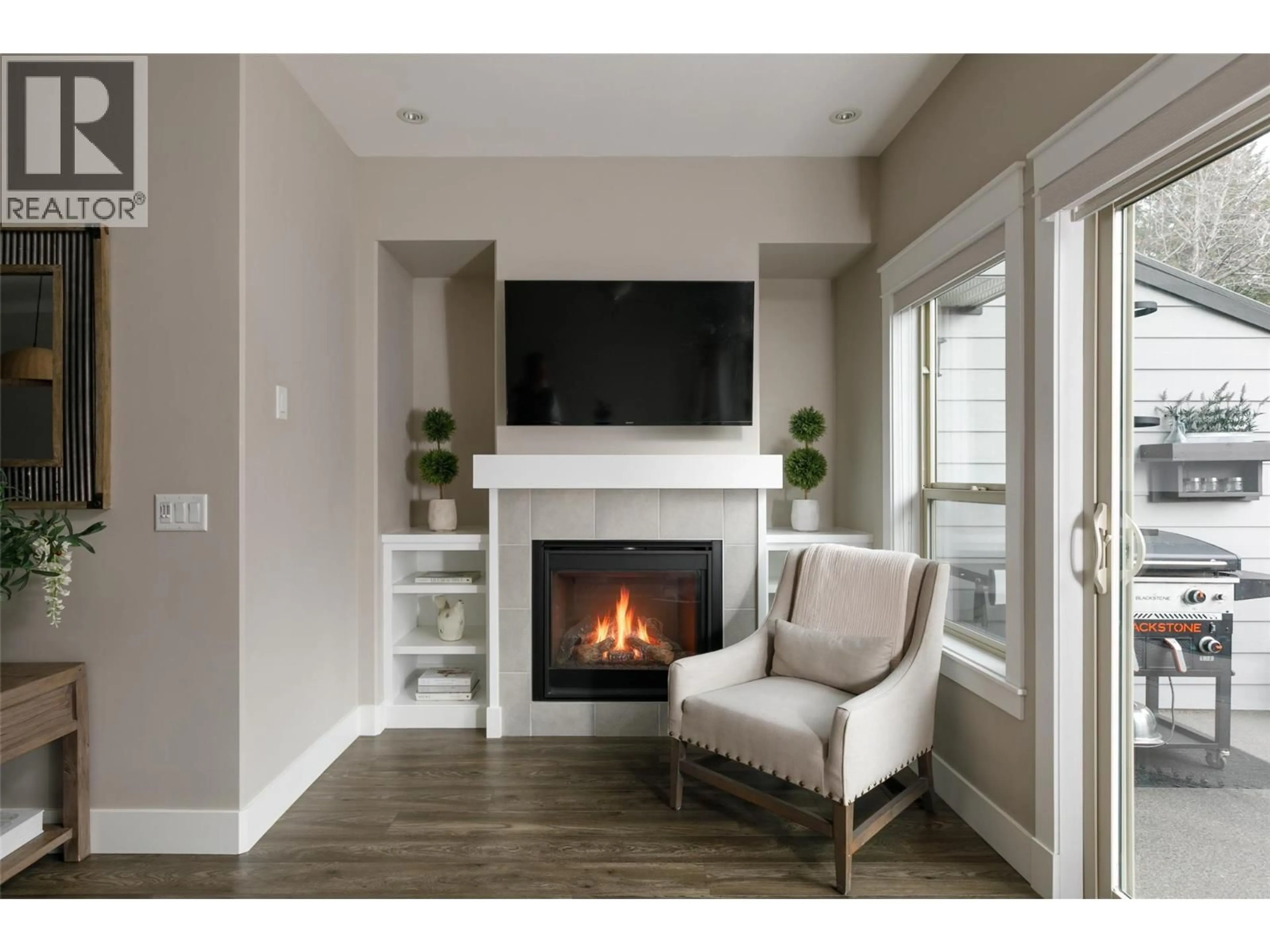 Living room with furniture, wood/laminate floor for 49 - 3359 COUGAR ROAD, Westbank British Columbia V4T3G1