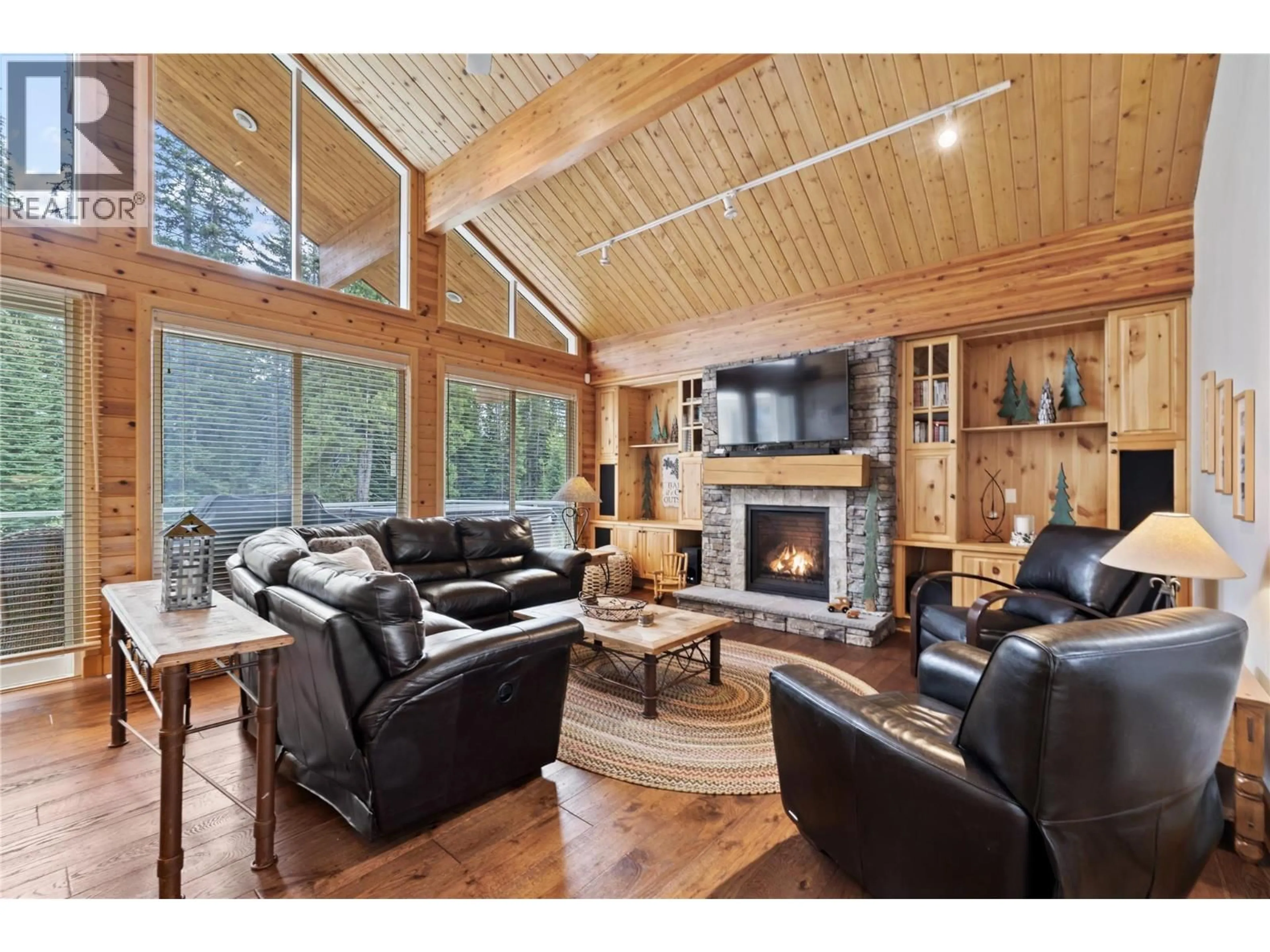 Living room with furniture, wood/laminate floor for A - 5946 SNOW PINES CRESCENT, Big White British Columbia V1P1T4
