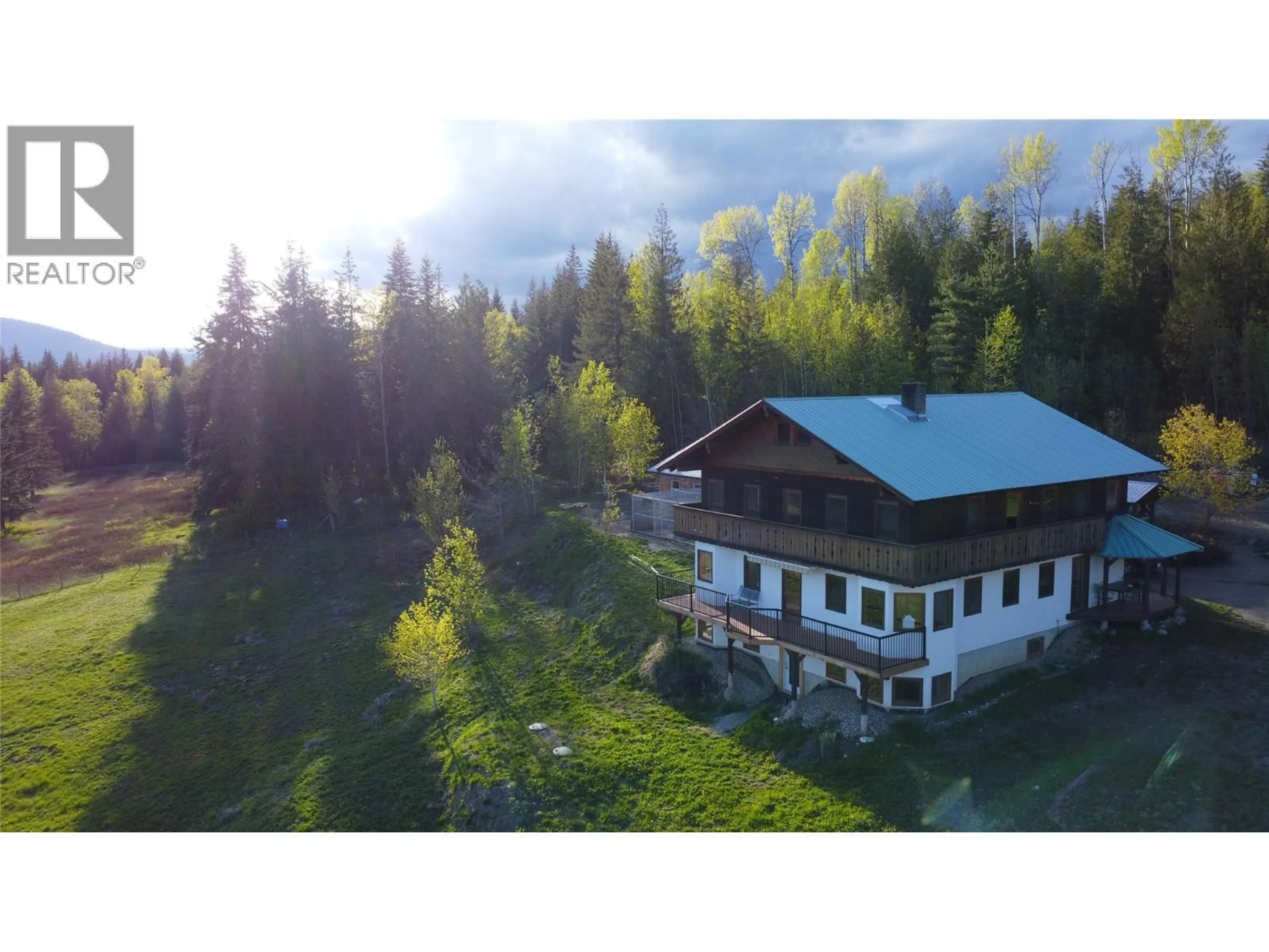 A pic from outside/outdoor area/front of a property/back of a property/a pic from drone, mountain view for 100 LIDSTONE ROAD, Salmon Arm British Columbia V1E2Y1