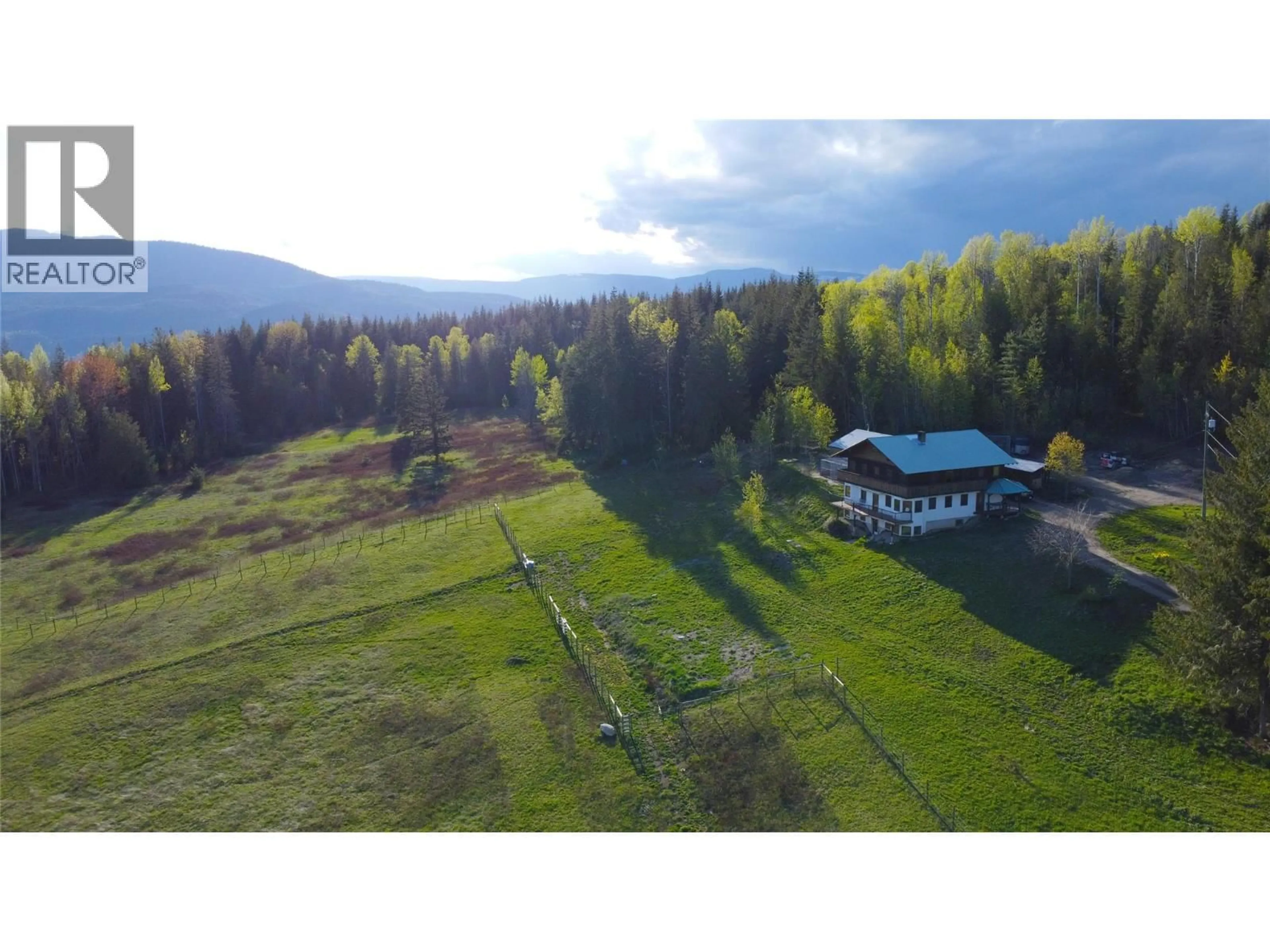 A pic from outside/outdoor area/front of a property/back of a property/a pic from drone, mountain view for 100 LIDSTONE ROAD, Salmon Arm British Columbia V1E2Y1