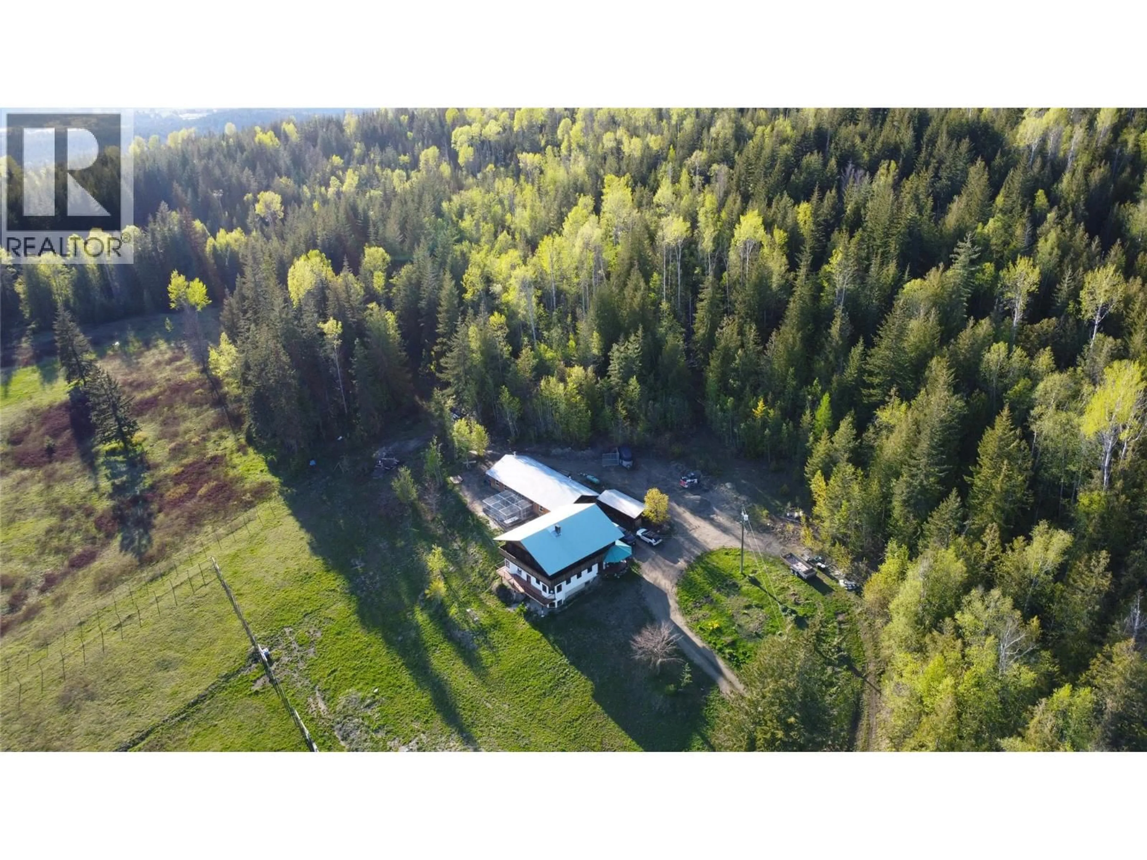 A pic from outside/outdoor area/front of a property/back of a property/a pic from drone, forest/trees view for 100 LIDSTONE ROAD, Salmon Arm British Columbia V1E2Y1