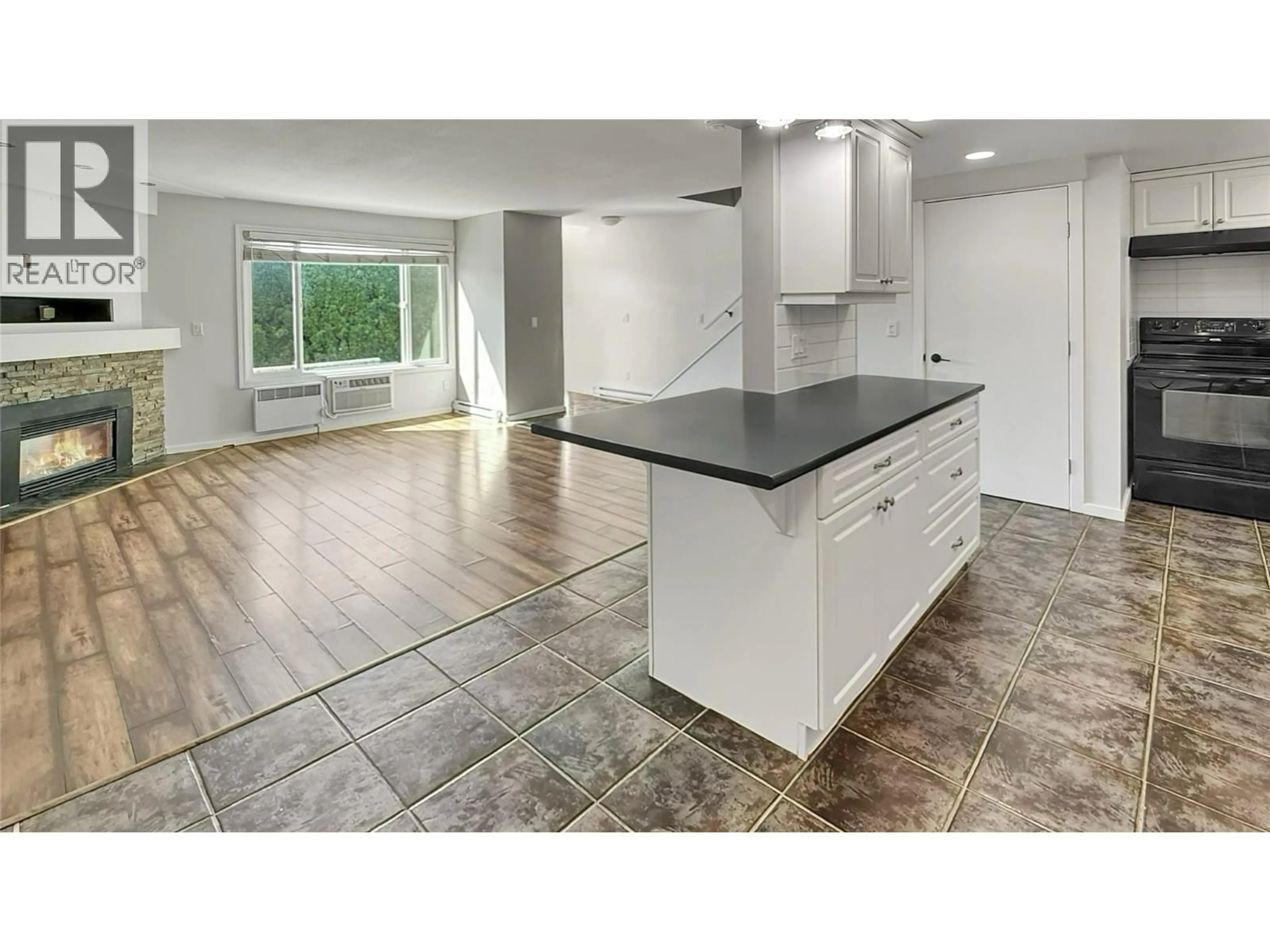 Open concept kitchen, ceramic/tile floor for 17 - 1471 INKAR ROAD, Kelowna British Columbia V1Y8J1