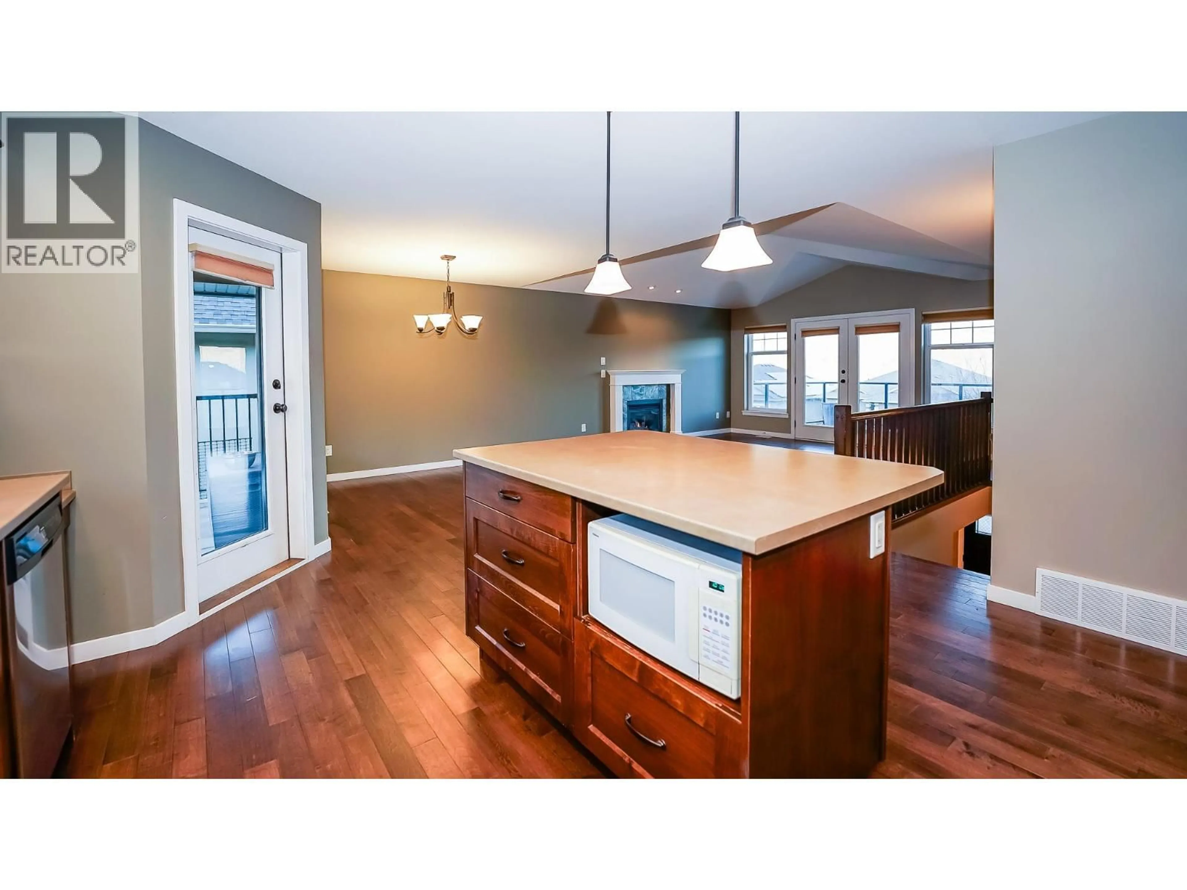 Open concept kitchen, wood/laminate floor for 2023 SADDLEBACK DRIVE, Kamloops British Columbia V2B0A6