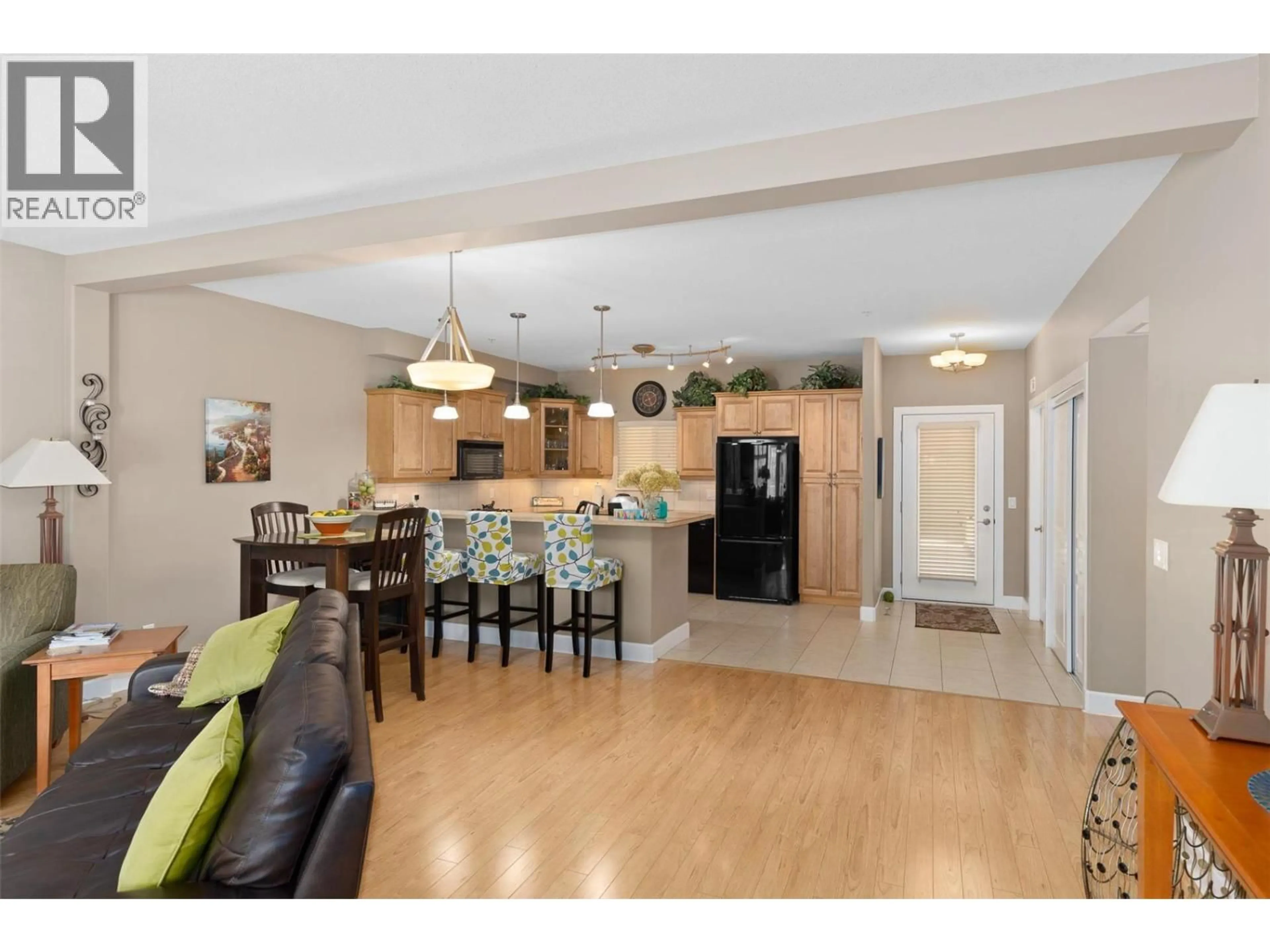 Open concept kitchen, wood/laminate floor for 201 - 3996 BEACH AVENUE, Peachland British Columbia V0H1X5