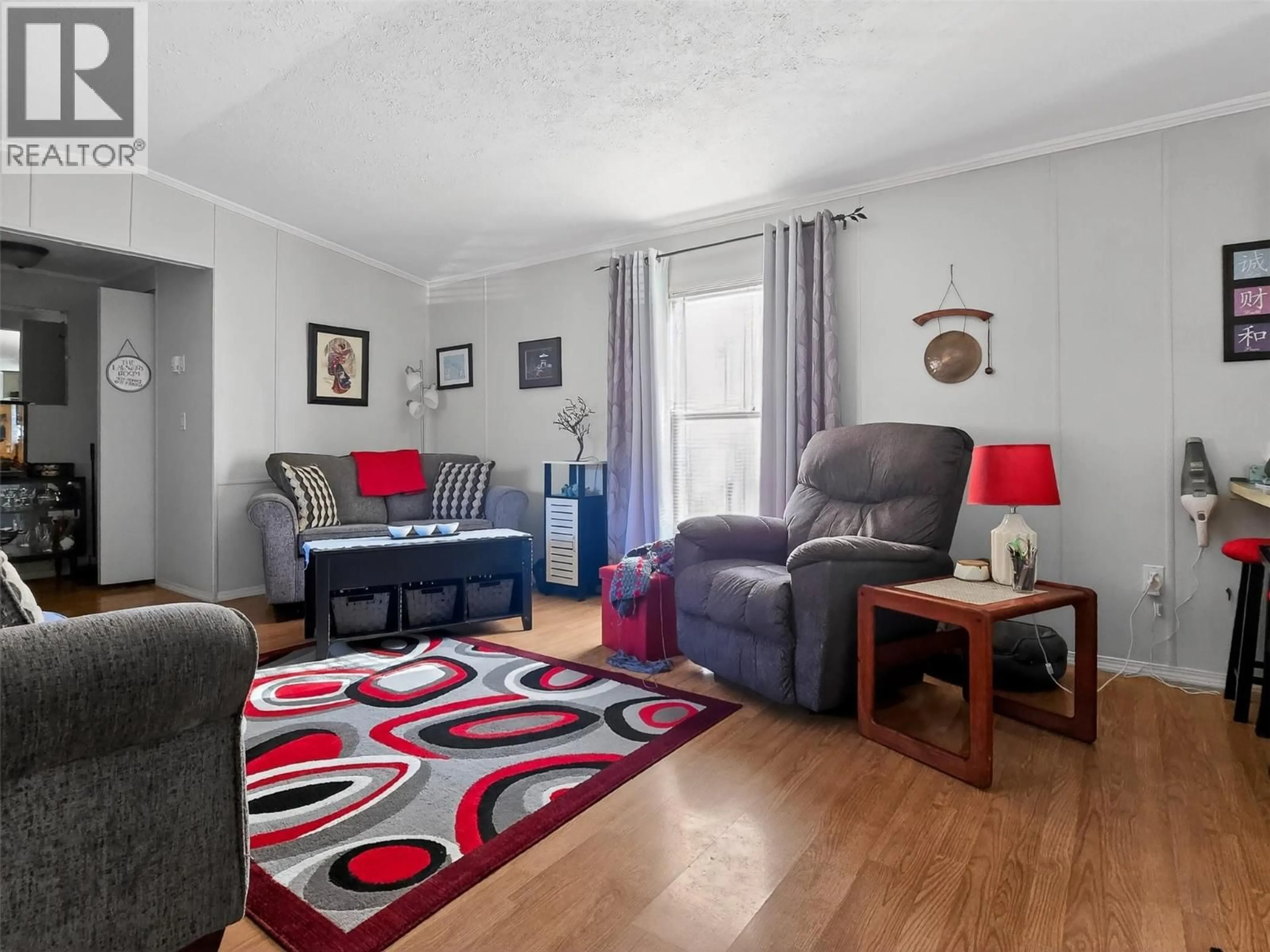 Living room with furniture, wood/laminate floor for 14 - 1230 MOHA ROAD, Lillooet British Columbia V0K1V0