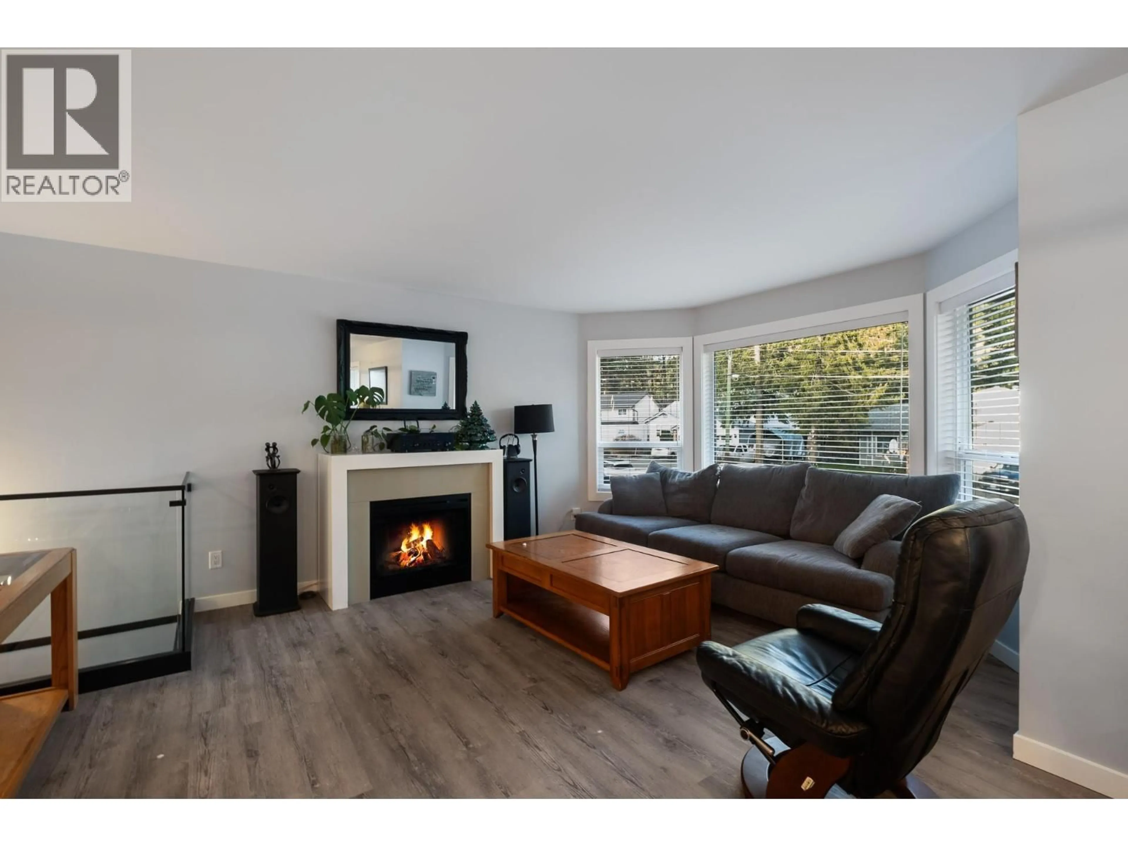 Living room with furniture, wood/laminate floor for 3118 MCIVER ROAD, West Kelowna British Columbia V4T1E6