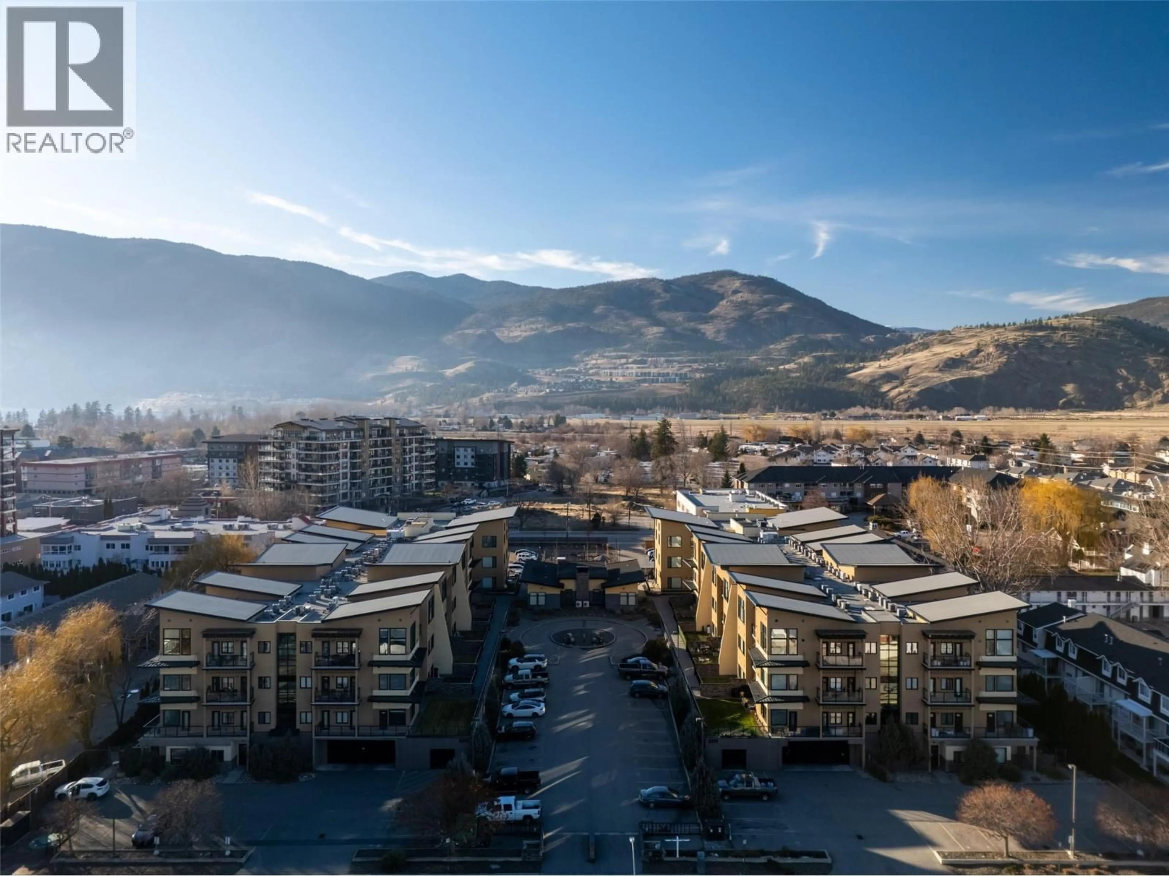 A pic from outside/outdoor area/front of a property/back of a property/a pic from drone, mountain view for 404 - 3313 WILSON STREET, Penticton British Columbia V2A8J3