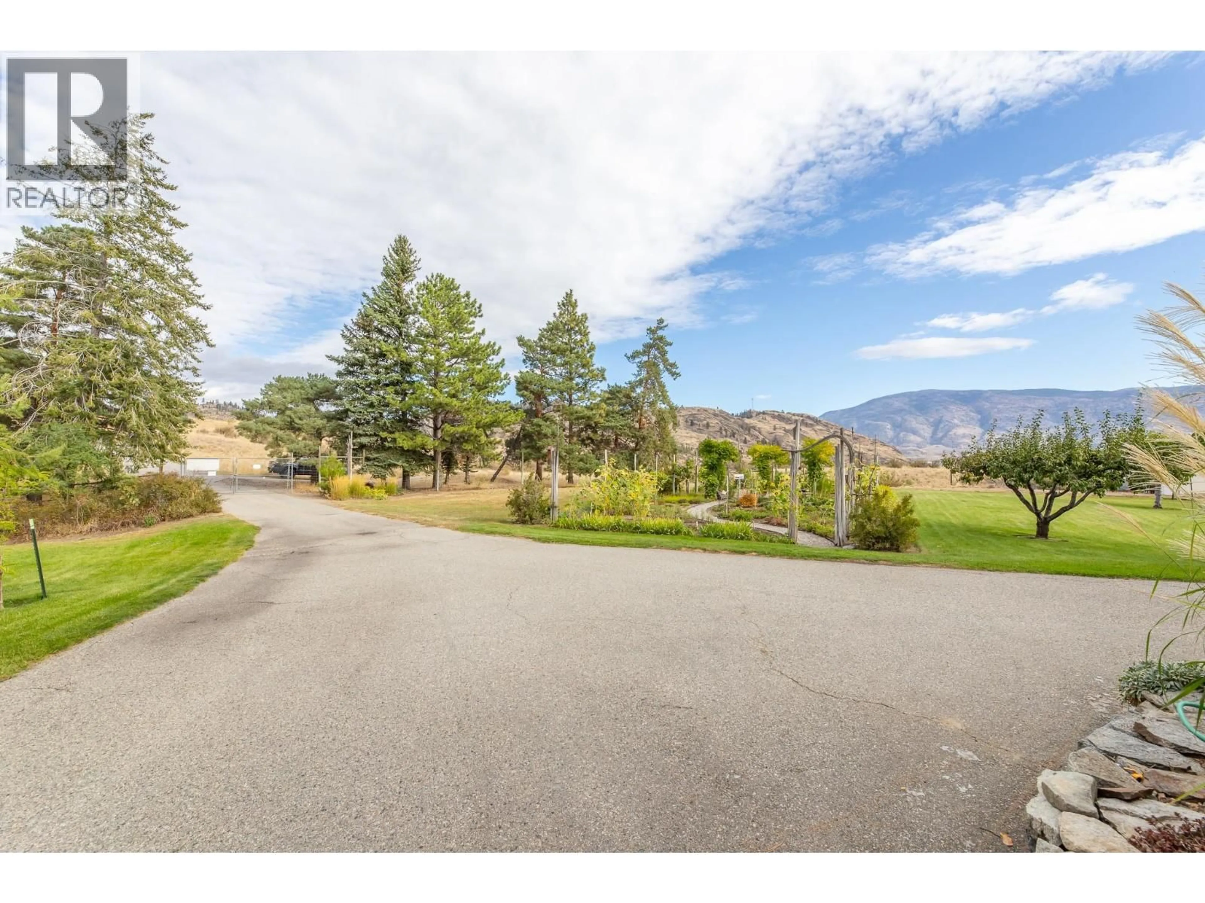 A pic from outside/outdoor area/front of a property/back of a property/a pic from drone, mountain view for 101 KNIPPELBERG ROAD, Oliver British Columbia V0H1T5