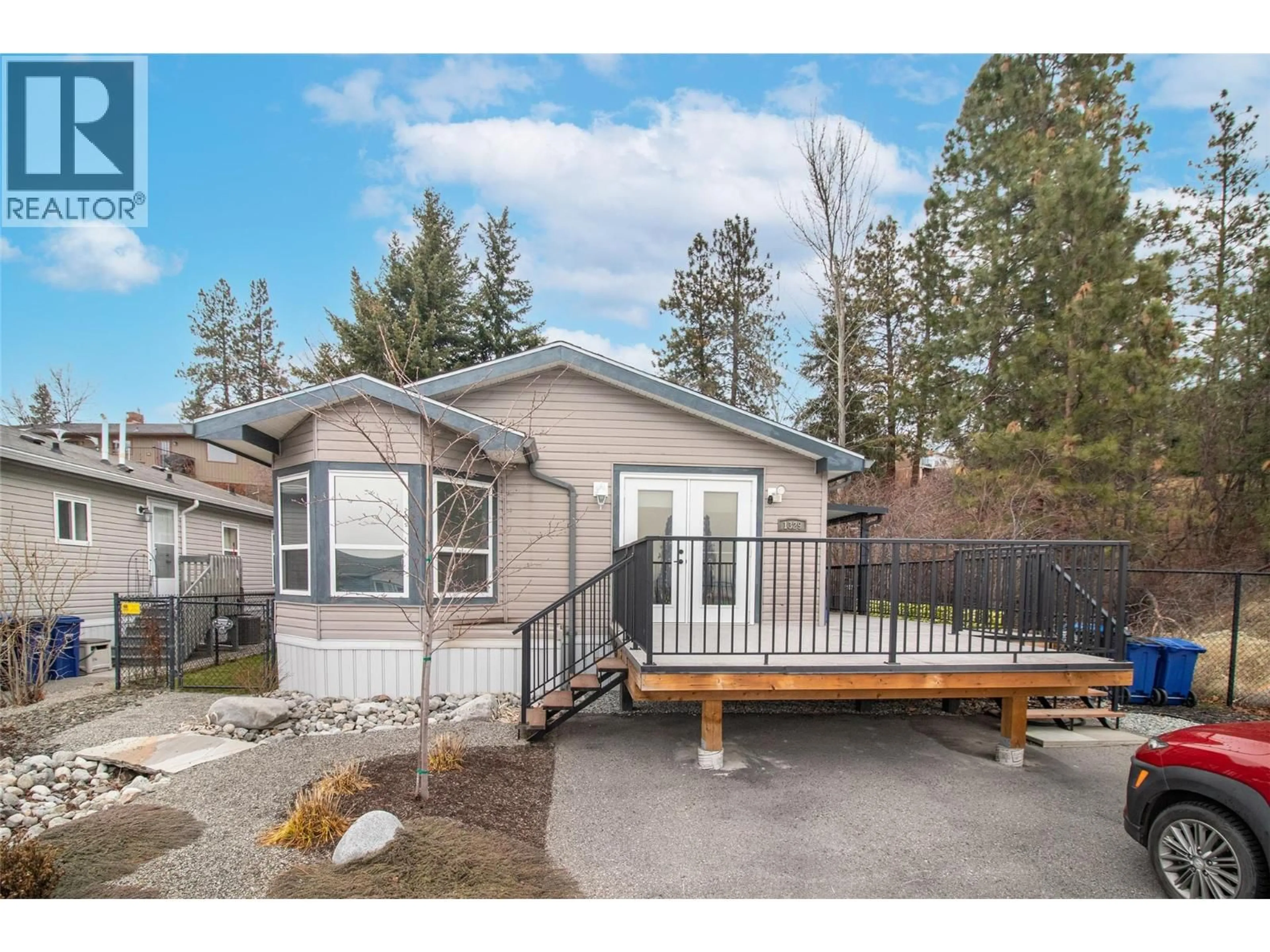 Home with vinyl exterior material, street for 1329 - 2440 OLD OKANAGAN HIGHWAY, West Kelowna British Columbia V4T3A2