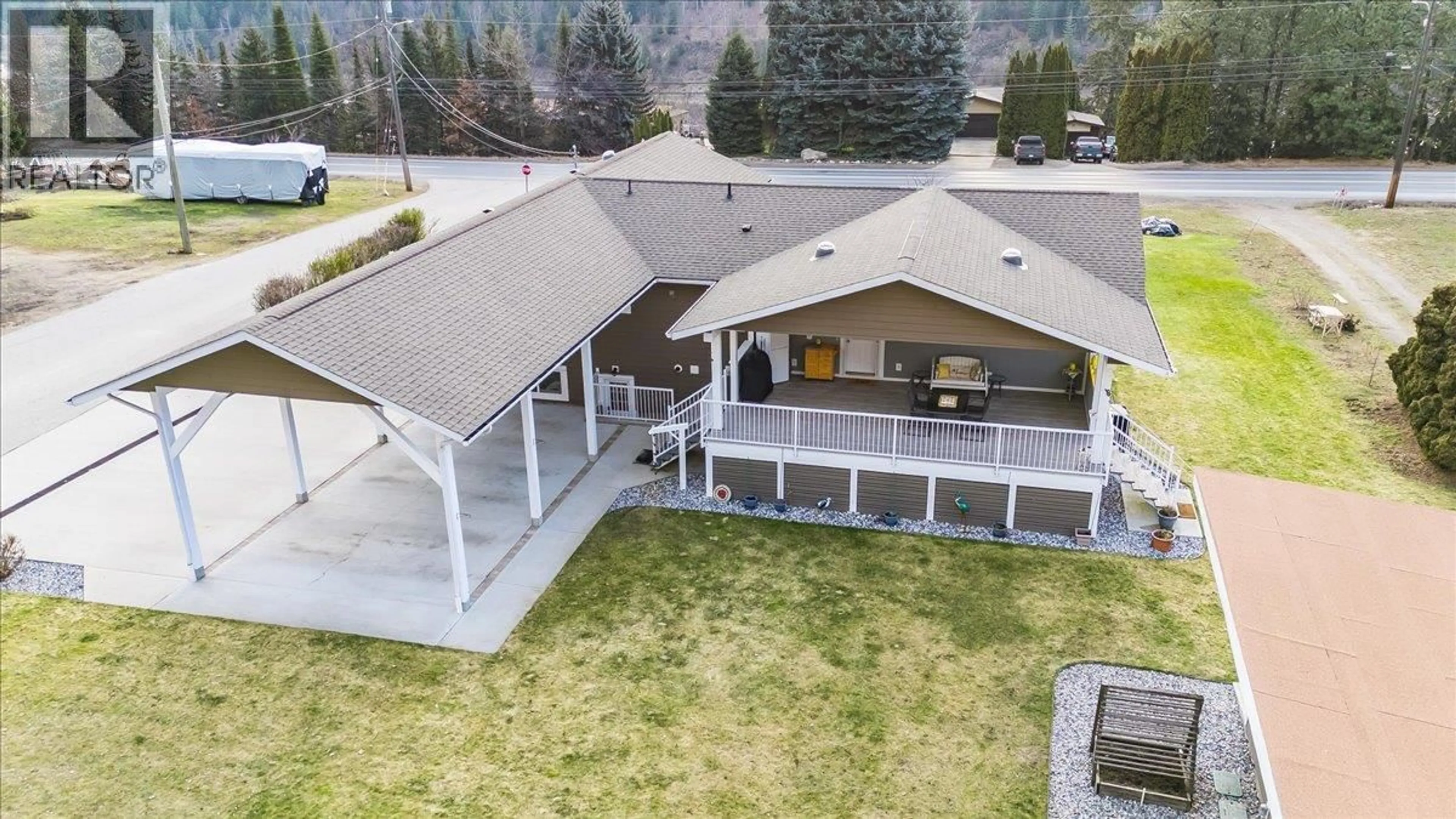 A pic from outside/outdoor area/front of a property/back of a property/a pic from drone, mountain view for 8480 HIGHWAY 22A OTHER, Trail British Columbia V1R4W8