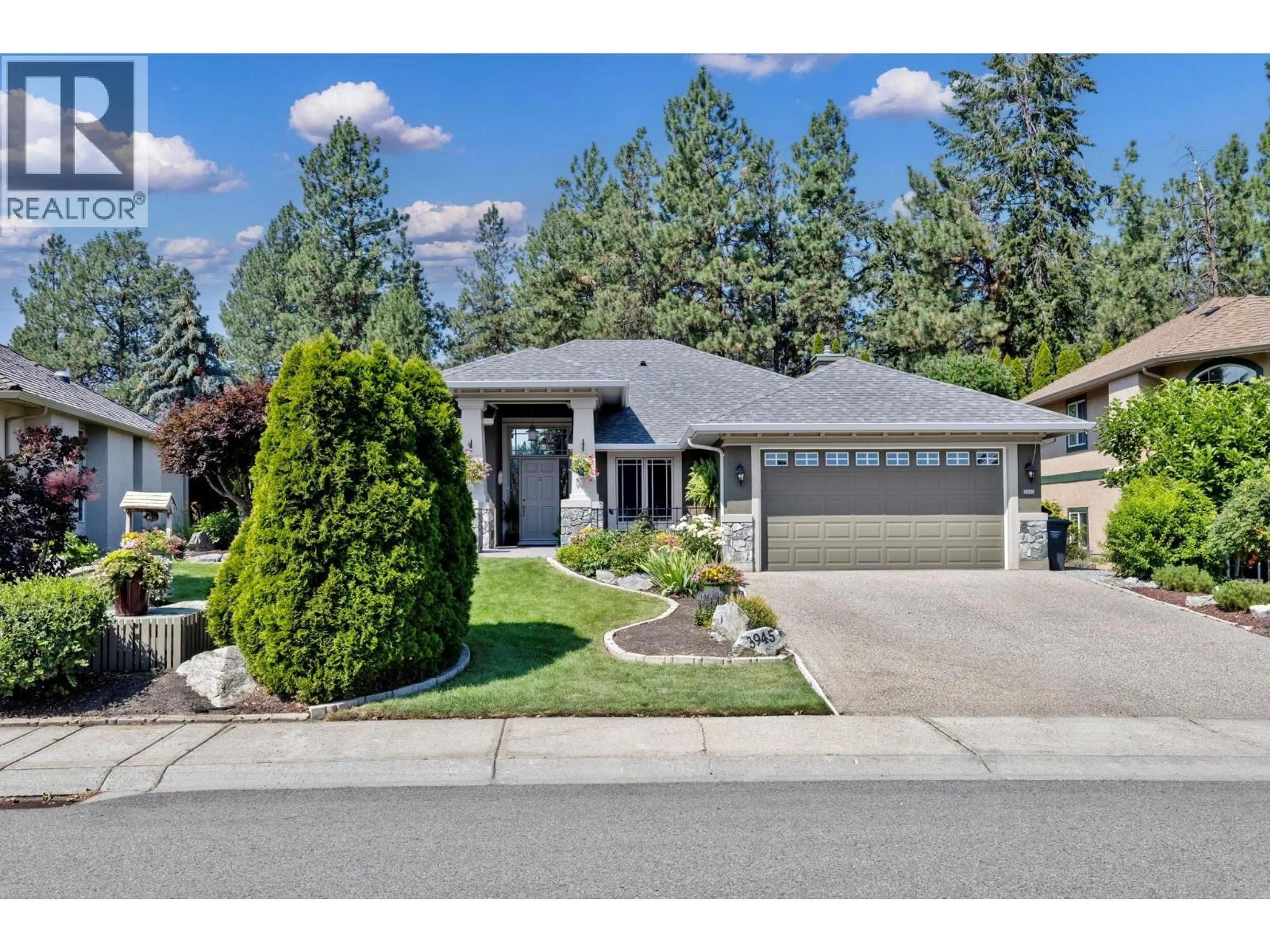 Home with vinyl exterior material, street for 3945 GALLAGHERS CIRCLE, Kelowna British Columbia V1W3Z9