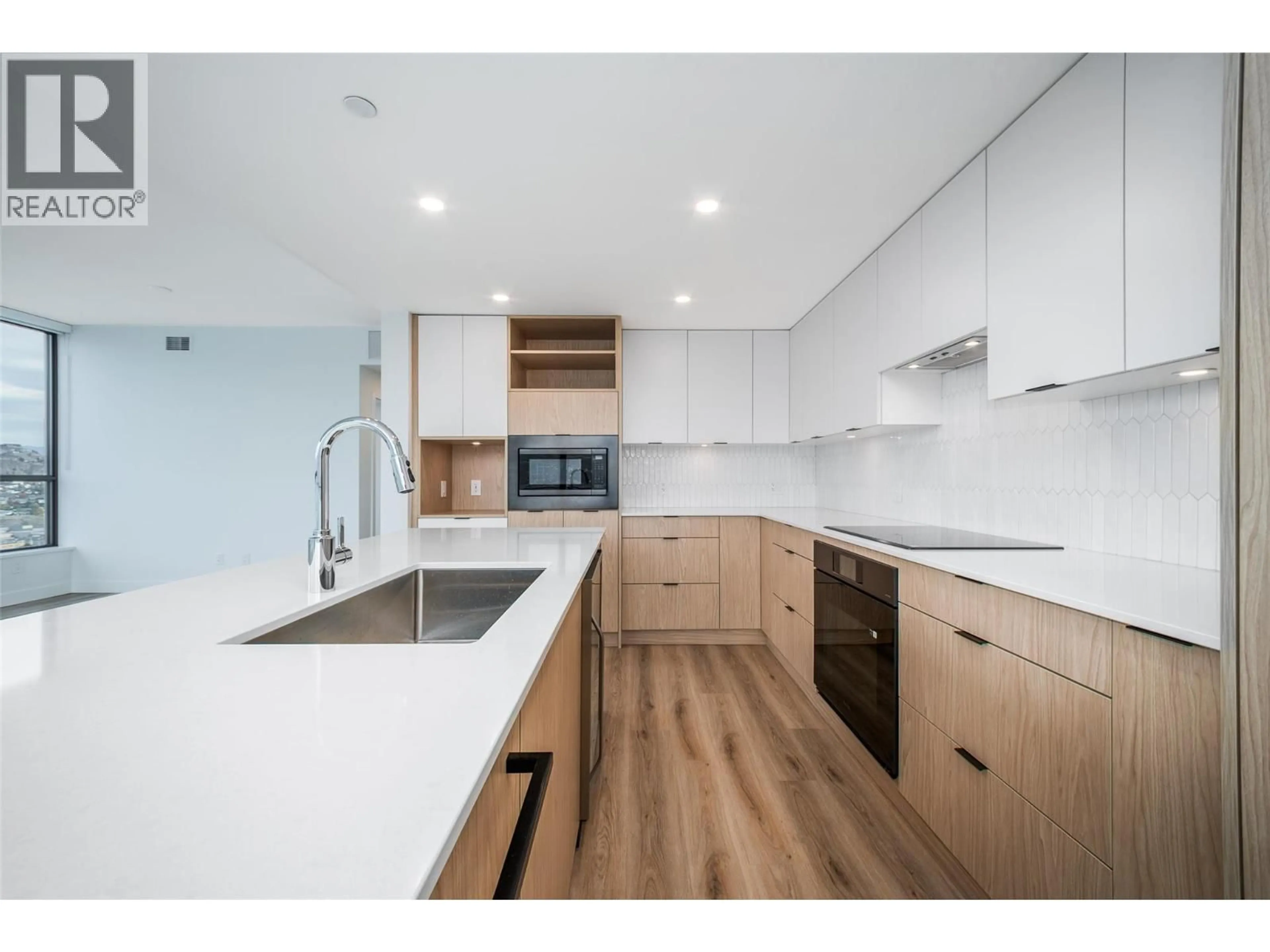 Contemporary kitchen, wood/laminate floor for 3307 - 1488 BERTRAM STREET, Kelowna British Columbia V1Y0M6