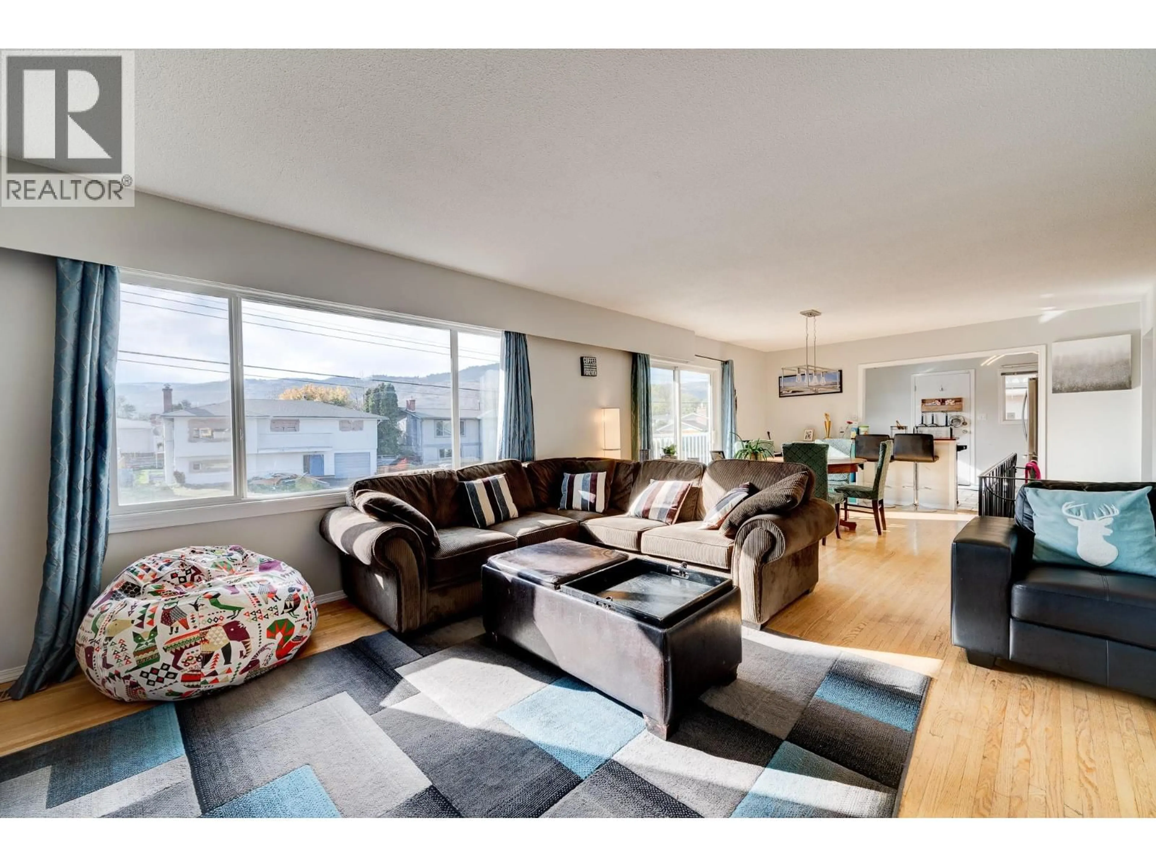 Living room with furniture, wood/laminate floor for 770 SHERWOOD DRIVE, Kamloops British Columbia V2B4E5