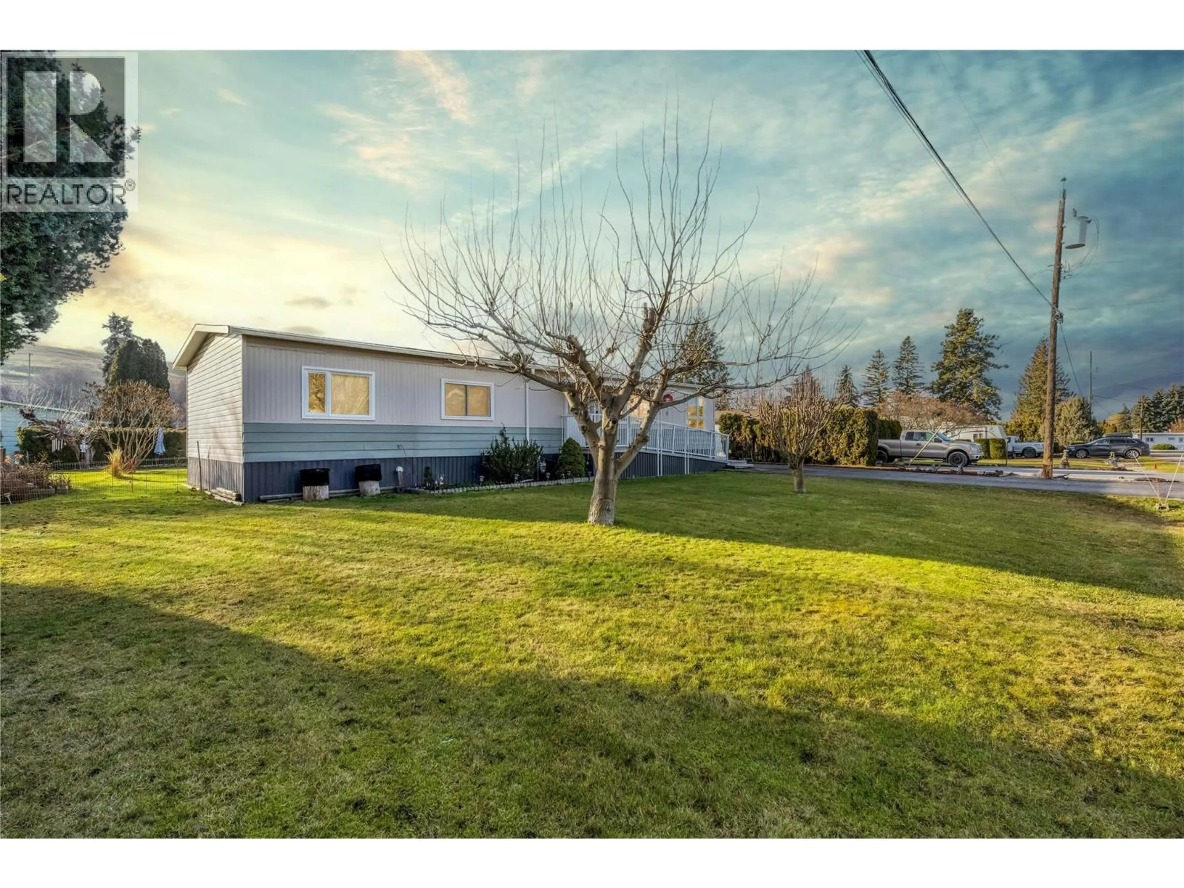 A pic from outside/outdoor area/front of a property/back of a property/a pic from drone, street for 6250 QUAIL ROAD, Vernon British Columbia V1H1M8