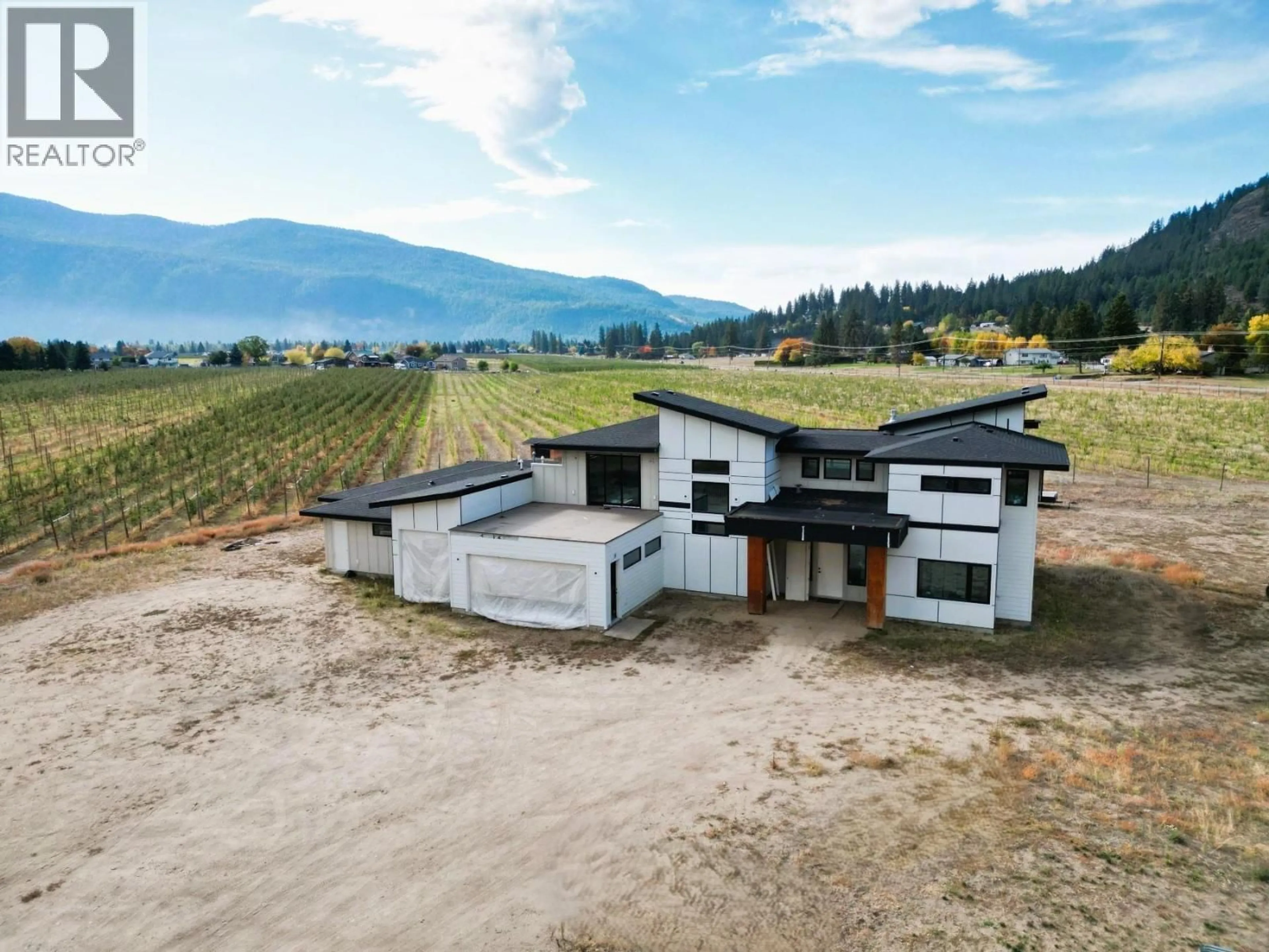 A pic from outside/outdoor area/front of a property/back of a property/a pic from drone, mountain view for 8077 DONALDSON DRIVE, Grand Forks British Columbia V0H1H0