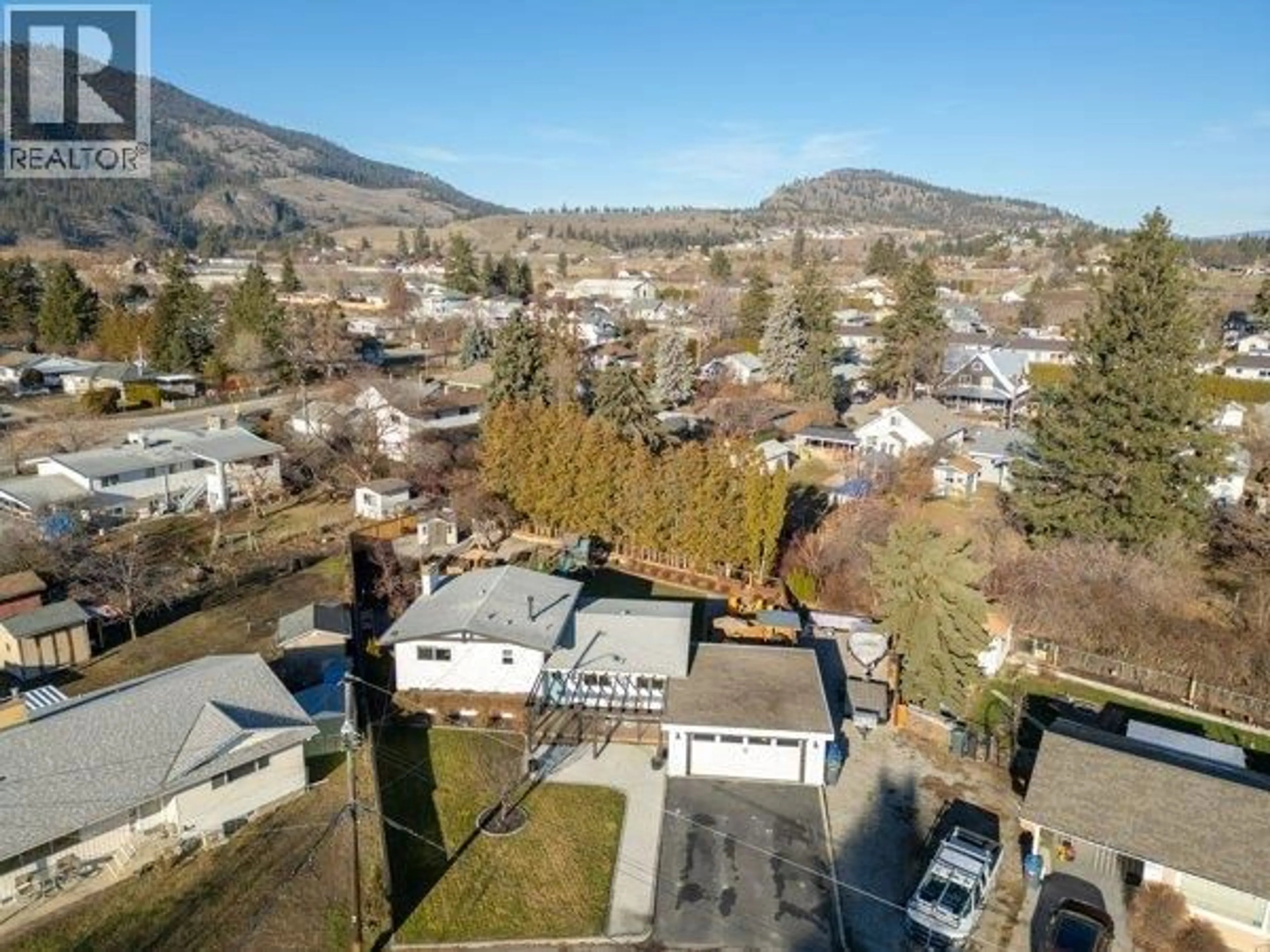 A pic from outside/outdoor area/front of a property/back of a property/a pic from drone, mountain view for 9574 ROBSON CRESCENT, Summerland British Columbia V0H1Z0