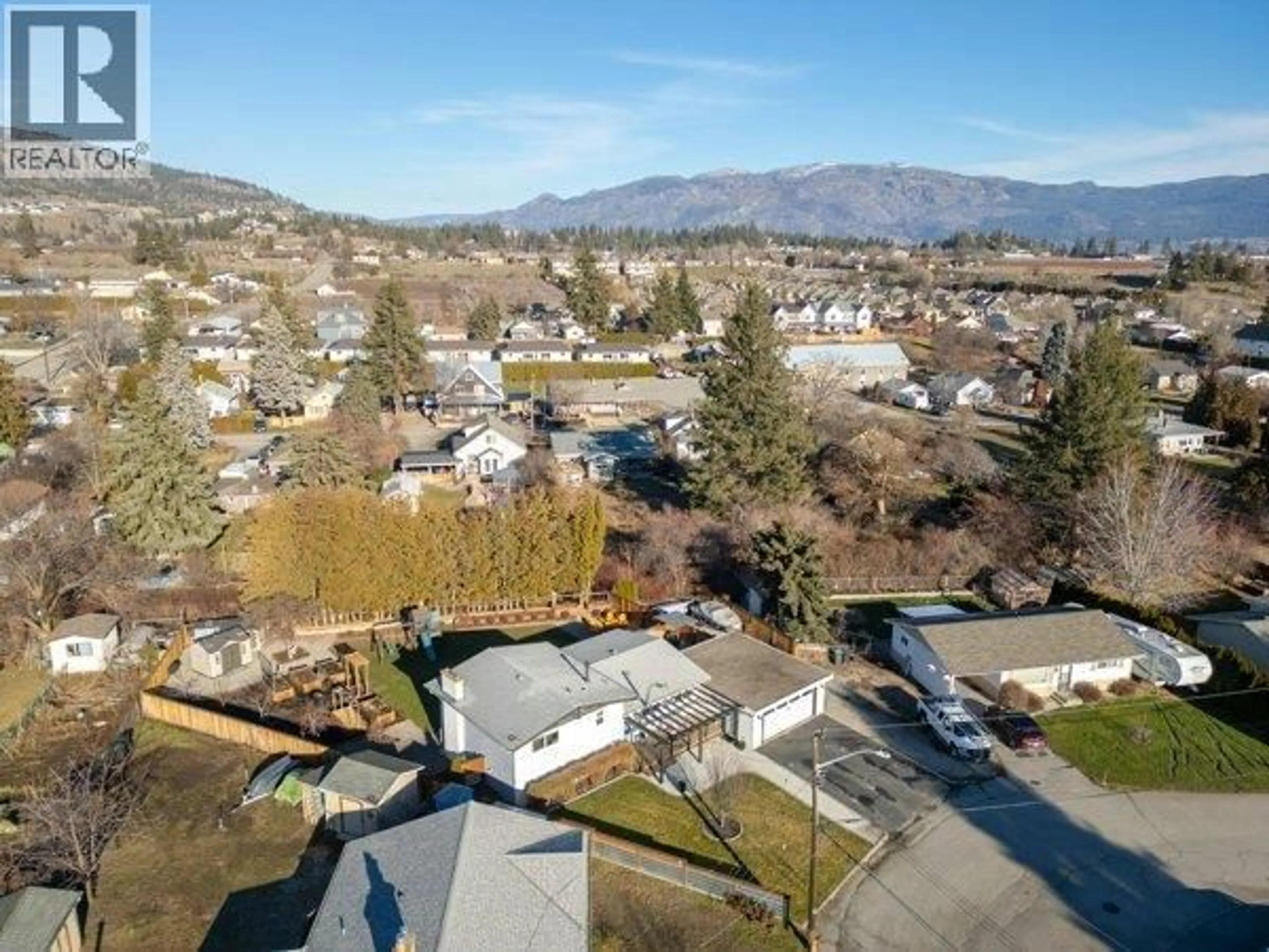 A pic from outside/outdoor area/front of a property/back of a property/a pic from drone, mountain view for 9574 ROBSON CRESCENT, Summerland British Columbia V0H1Z0