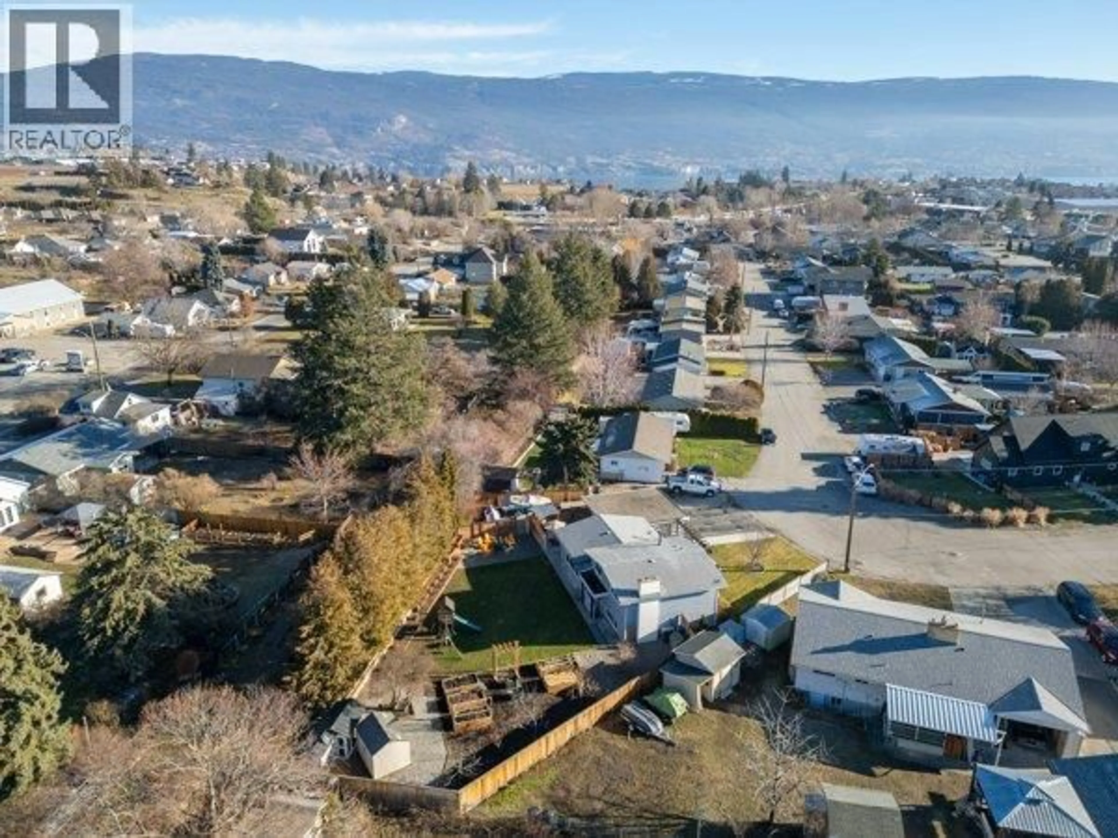 A pic from outside/outdoor area/front of a property/back of a property/a pic from drone, mountain view for 9574 ROBSON CRESCENT, Summerland British Columbia V0H1Z0