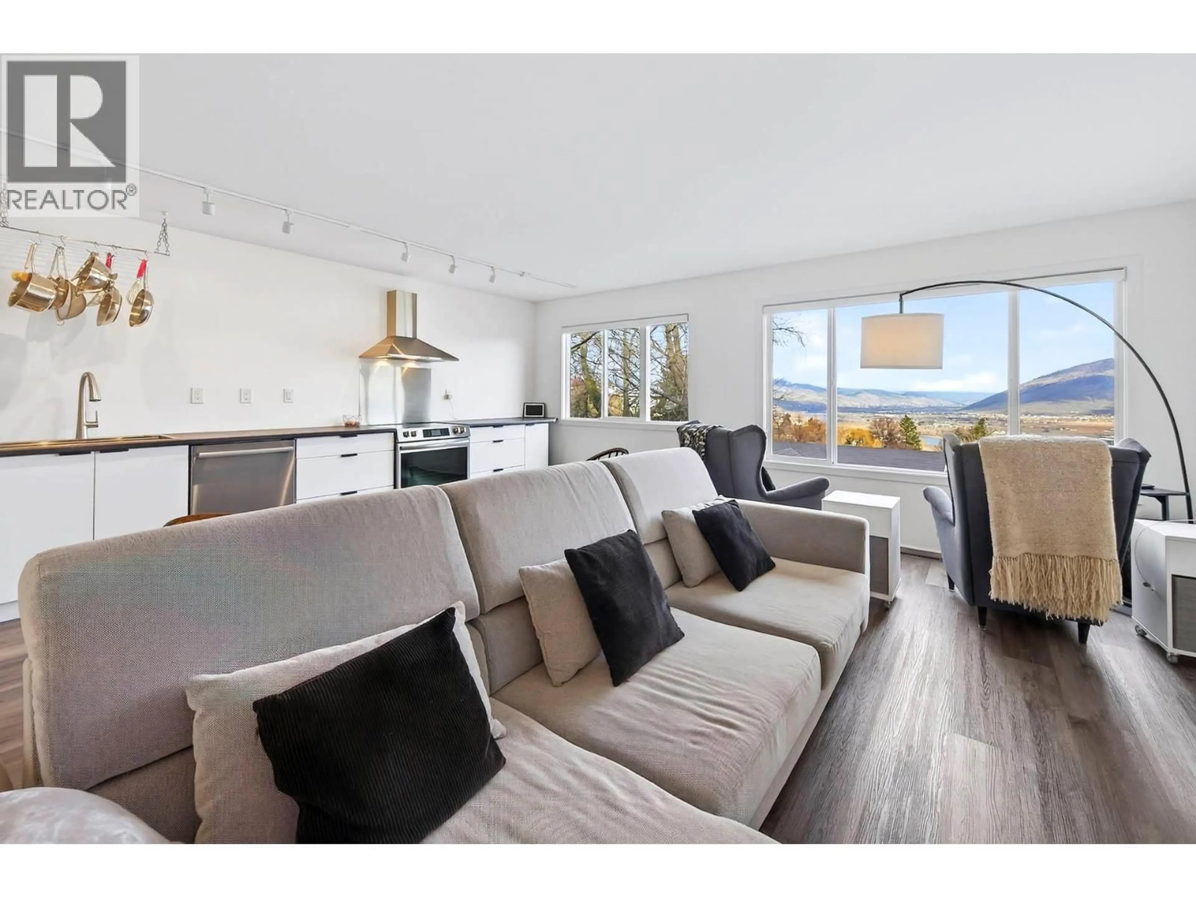 Living room with furniture, wood/laminate floor for 209 MCGILL ROAD, Kamloops British Columbia V2C1M2