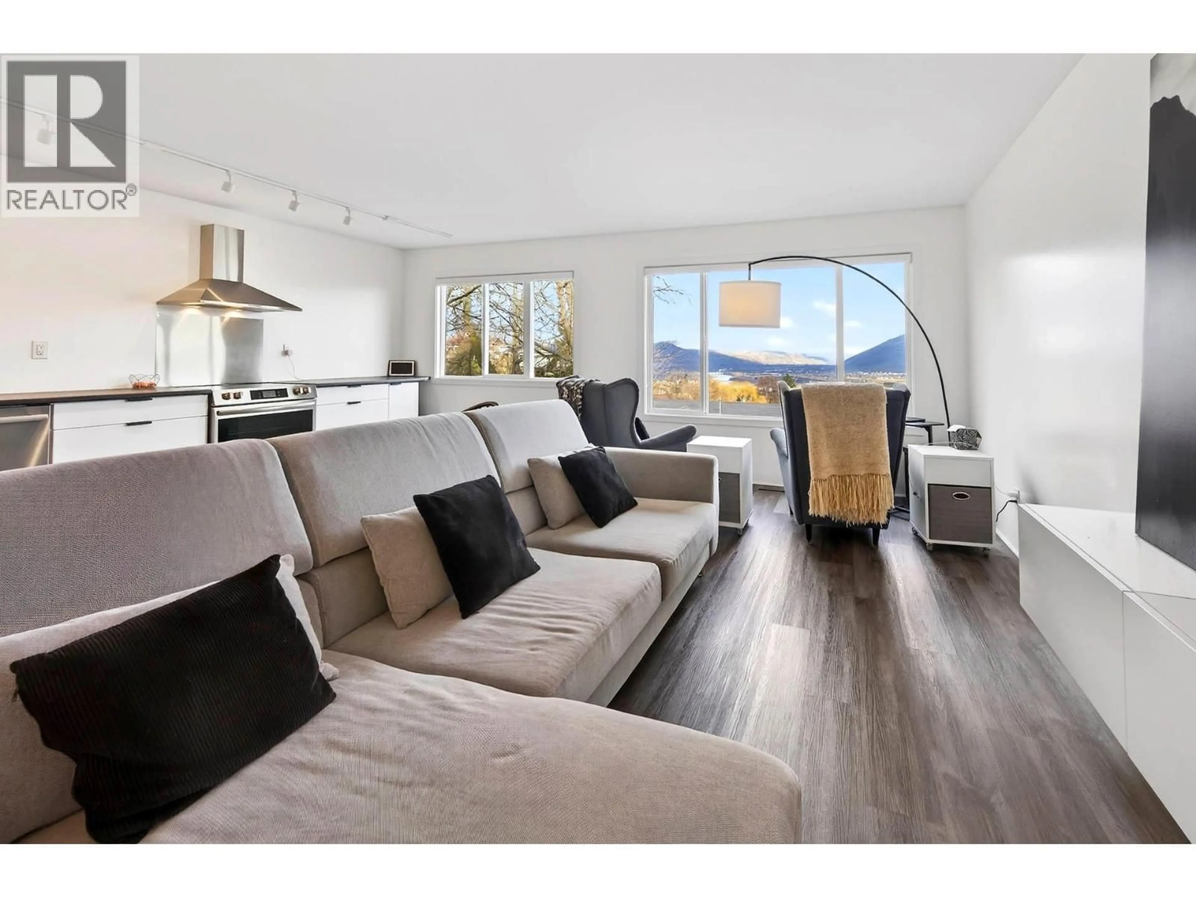 Living room with furniture, wood/laminate floor for 209 MCGILL ROAD, Kamloops British Columbia V2C1M2