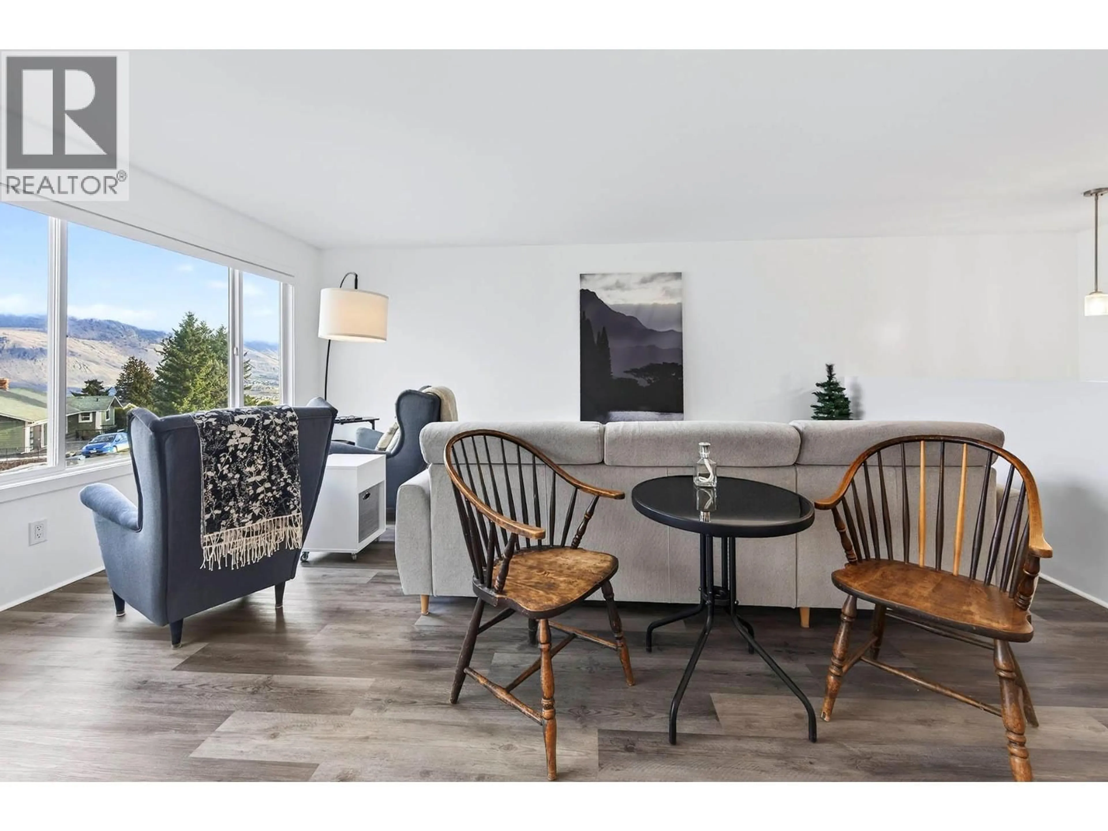 Living room with furniture, wood/laminate floor for 209 MCGILL ROAD, Kamloops British Columbia V2C1M2