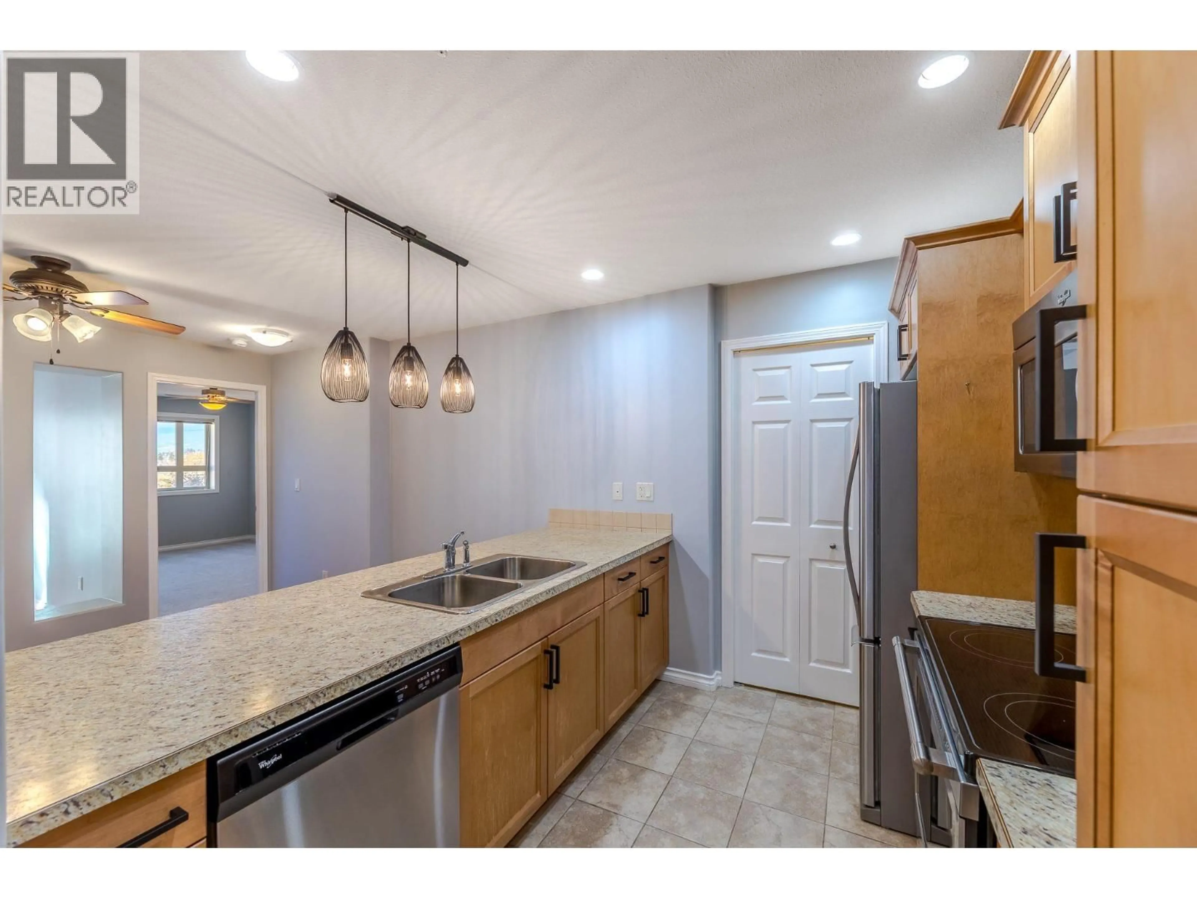 Open concept kitchen, ceramic/tile floor for 704 - 2125 ATKINSON STREET, Penticton British Columbia V2A9E6