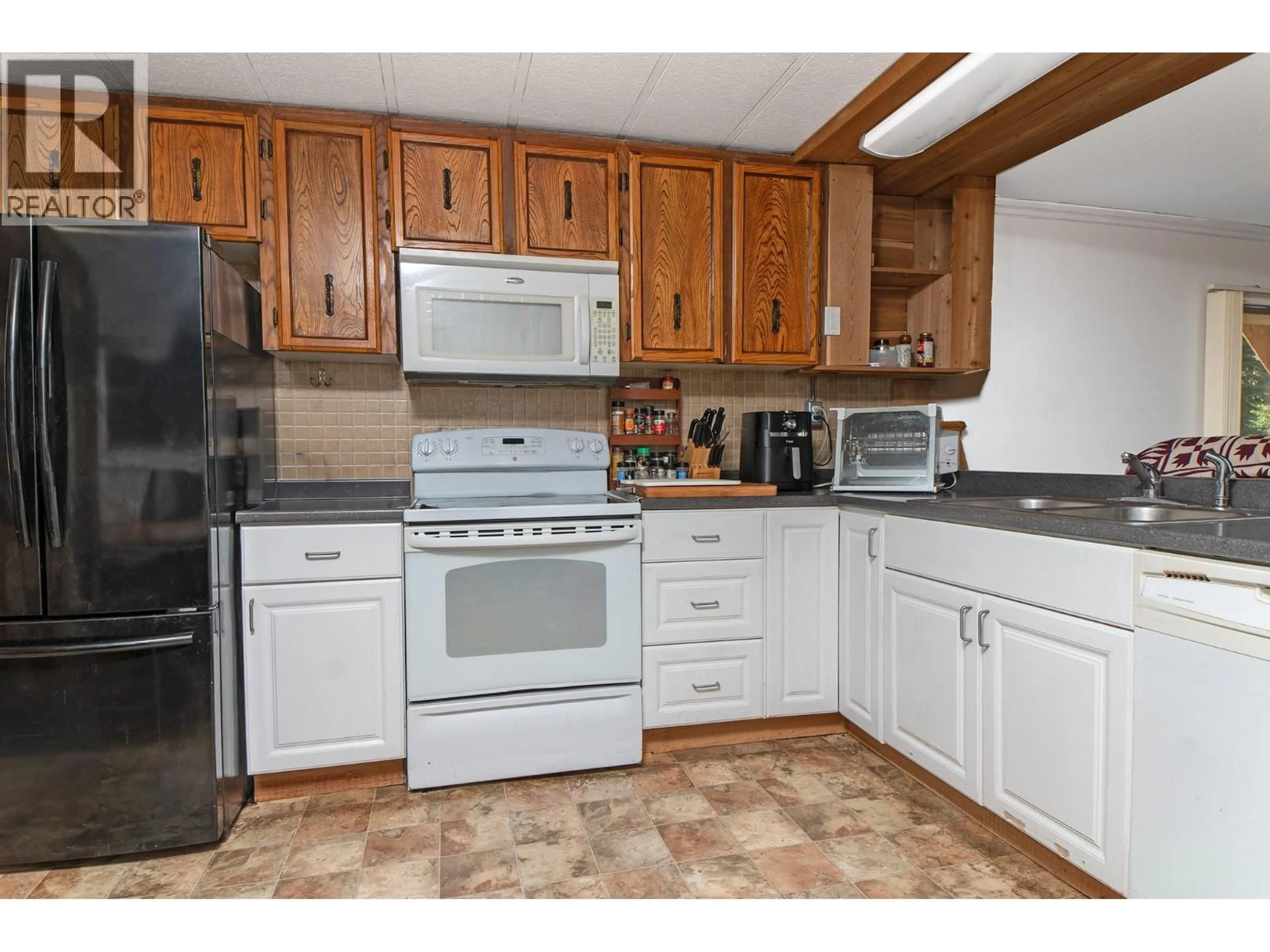 Standard kitchen, ceramic/tile floor for 4717 GOAT RIVER NORTH ROAD, Arrow Creek British Columbia V0B1G9